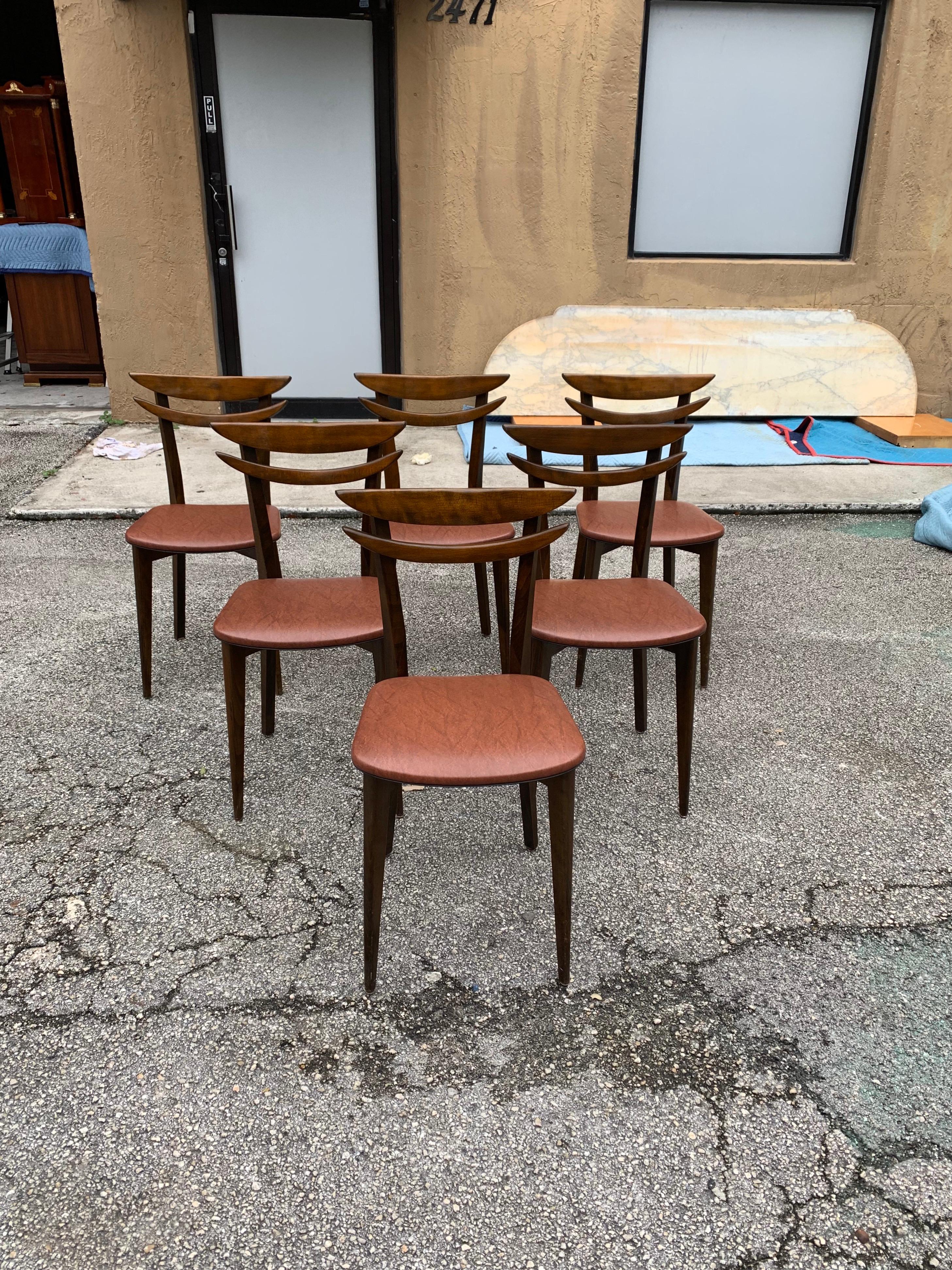 Classic set of six French Mid-Century Modern dining chairs solid mahogany, the chair frames are in excellent condition. The Reupholstery is vinyl and in very condition for all 6 dining chairs, the dining chairs are beautiful, circa 1950s.