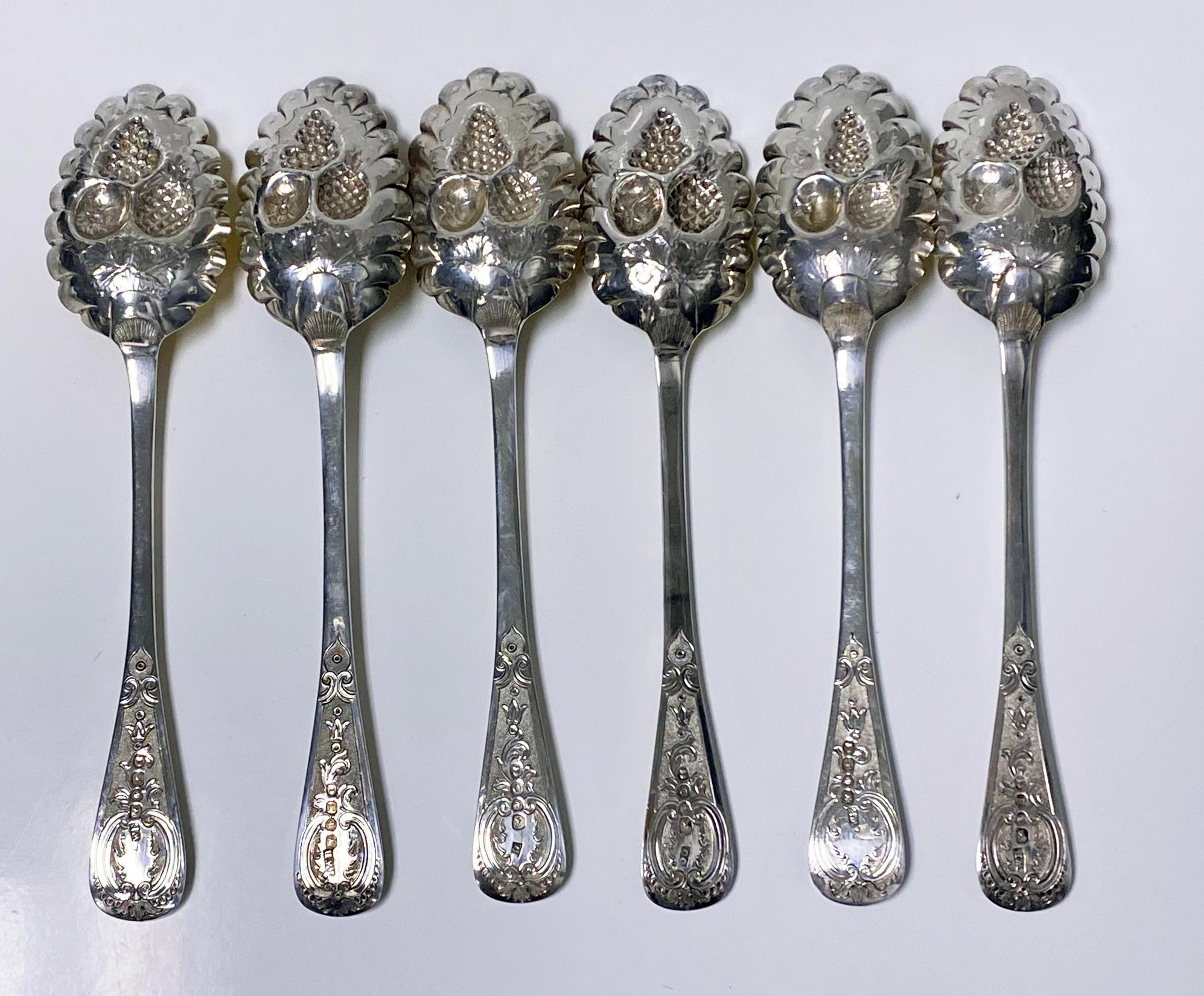 Set of 6 Georgian silver berry spoons, London, 1823-1829. Each of matching typical form, gilded embossed Berry scalloped bowls, handles with foliate Rocaille decoration on stippled background. 2 London 1823 William Eaton, 2 London 1827 John William