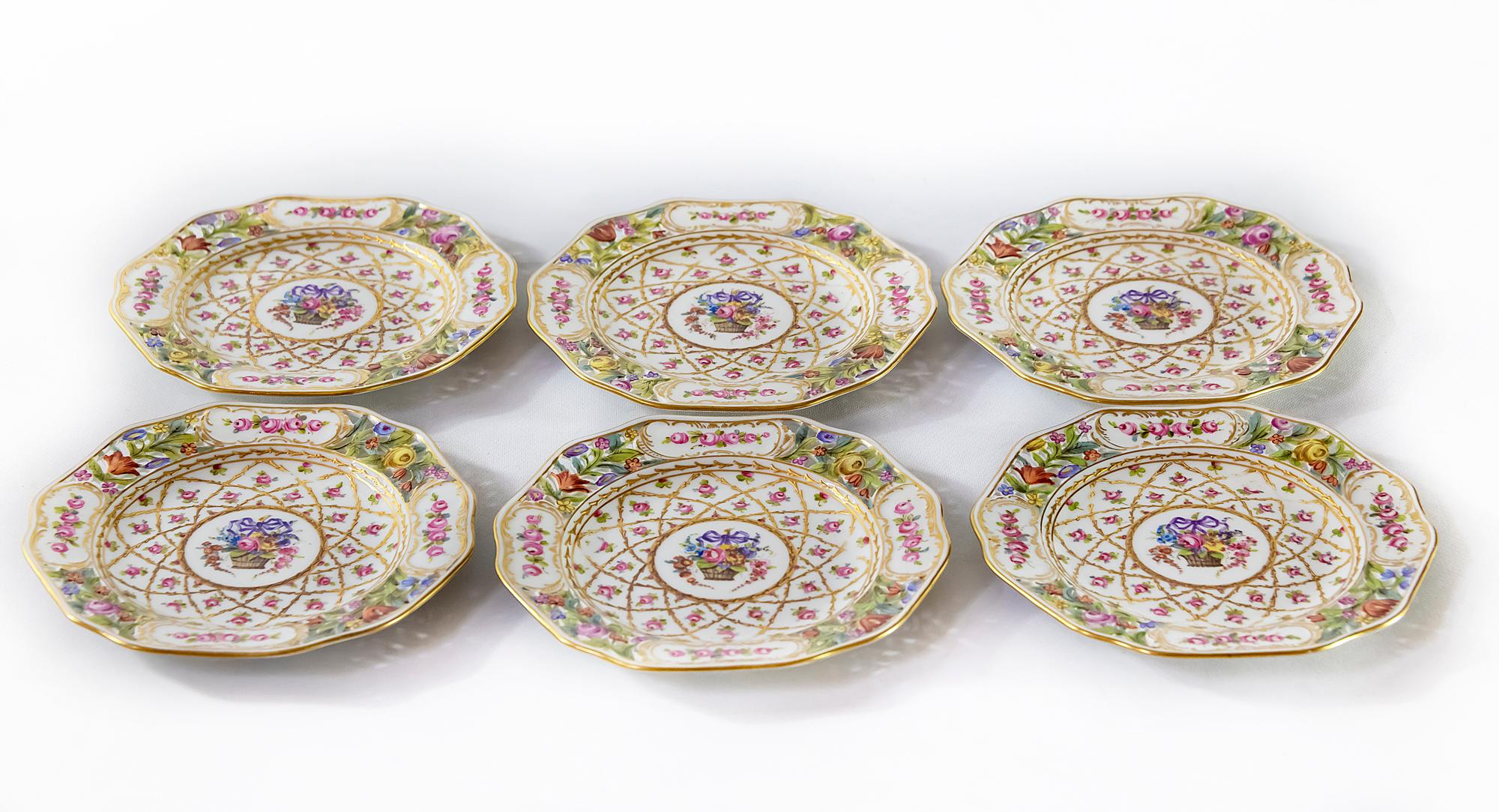 German Dresden porcelain plates.
Plates are hand painted with floral motives.
The edge of plate is perforated.
Dimentions: 16.5 x 1.8 (H) cm.
  