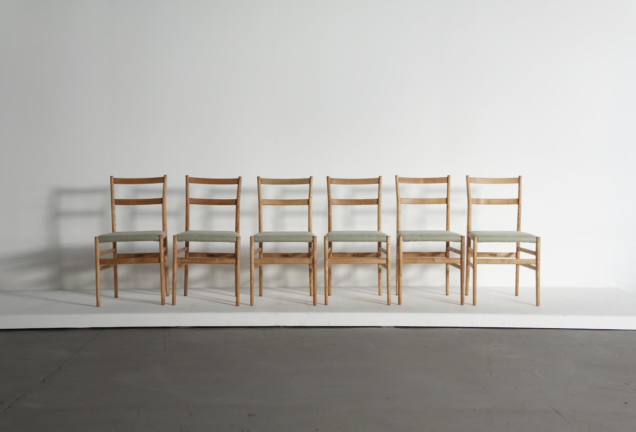 A wonderful set of six original, early Gio Ponti Leggera Model 646 dining chairs, Cassina, Italy, 1950s. In restored condition with new upholstery. All with maker’s label marked 'Figli di Amedeo Cassina' under each seat.   Fast shipping