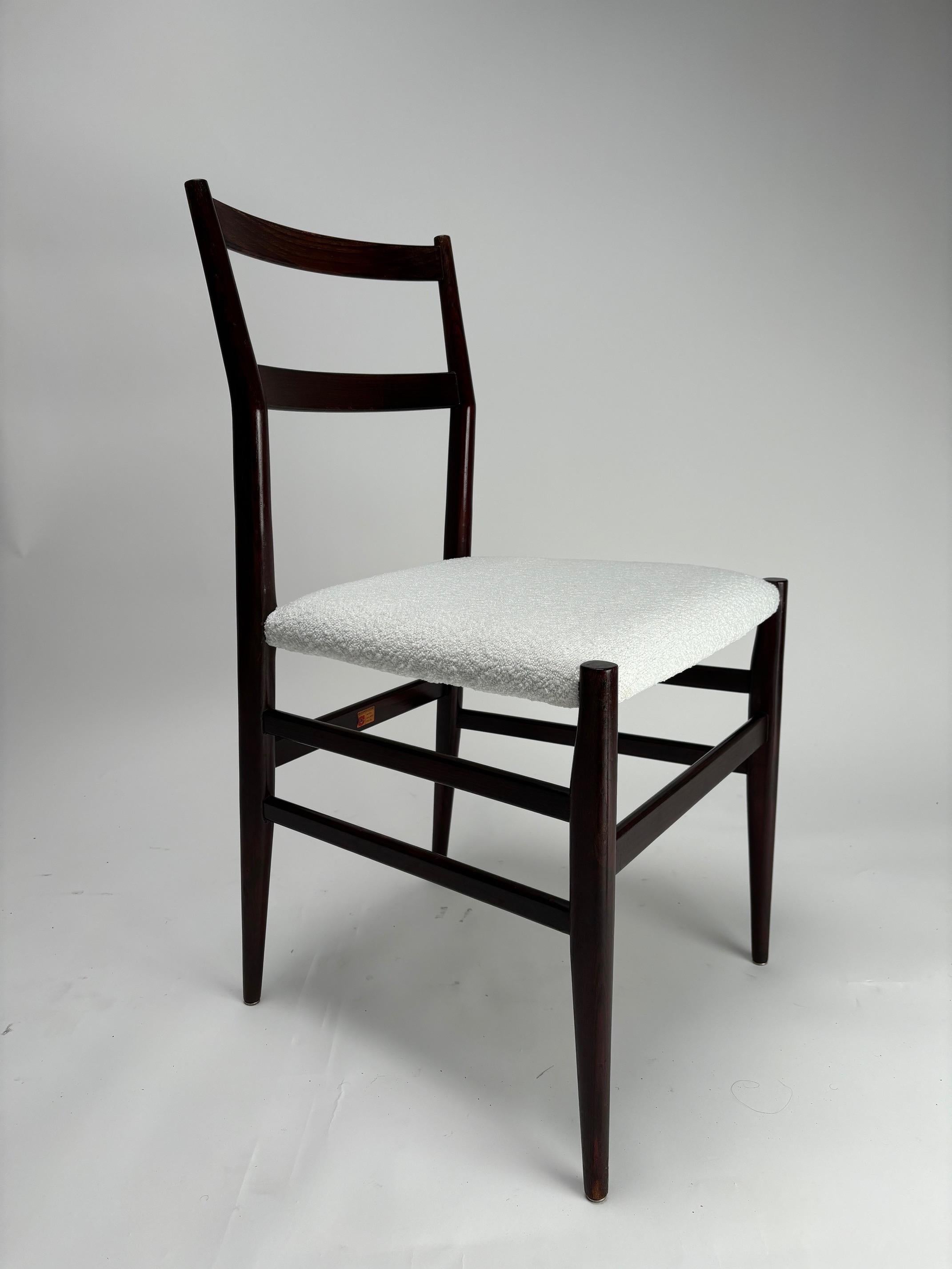 A wonderful set of 6 original, early Gio Ponti Leggera Model 646 dining chairs, Cassina, Italy, 1950s. In restored condition with new upholstery, dark red wood and bouclé fabric.
 All with maker’s label marked 'Figli di Amedeo Cassina' under each