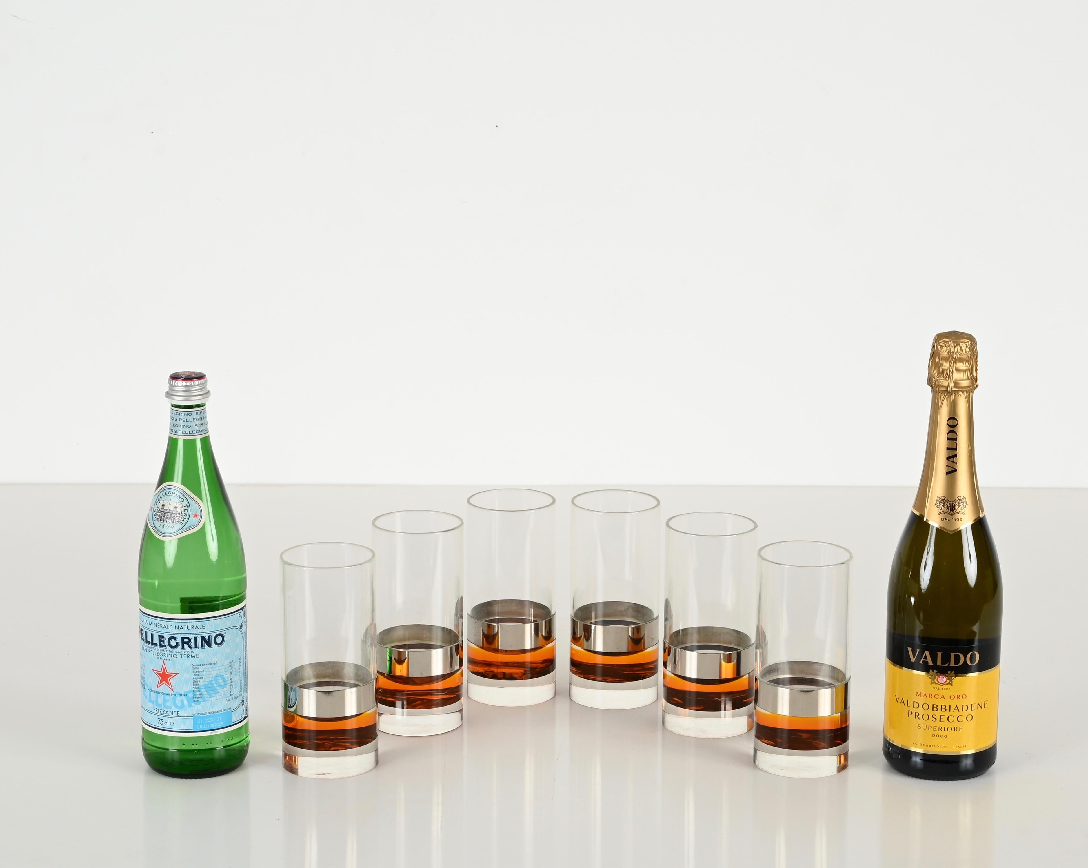 Stunning set of six glasses made in a gorgeous combination of clear and tortoiseshell lucite with chromed metal accents. These stylish glass were made in Italy during the 1970s in the style of Christian Dior.

These unique glasses feature a round