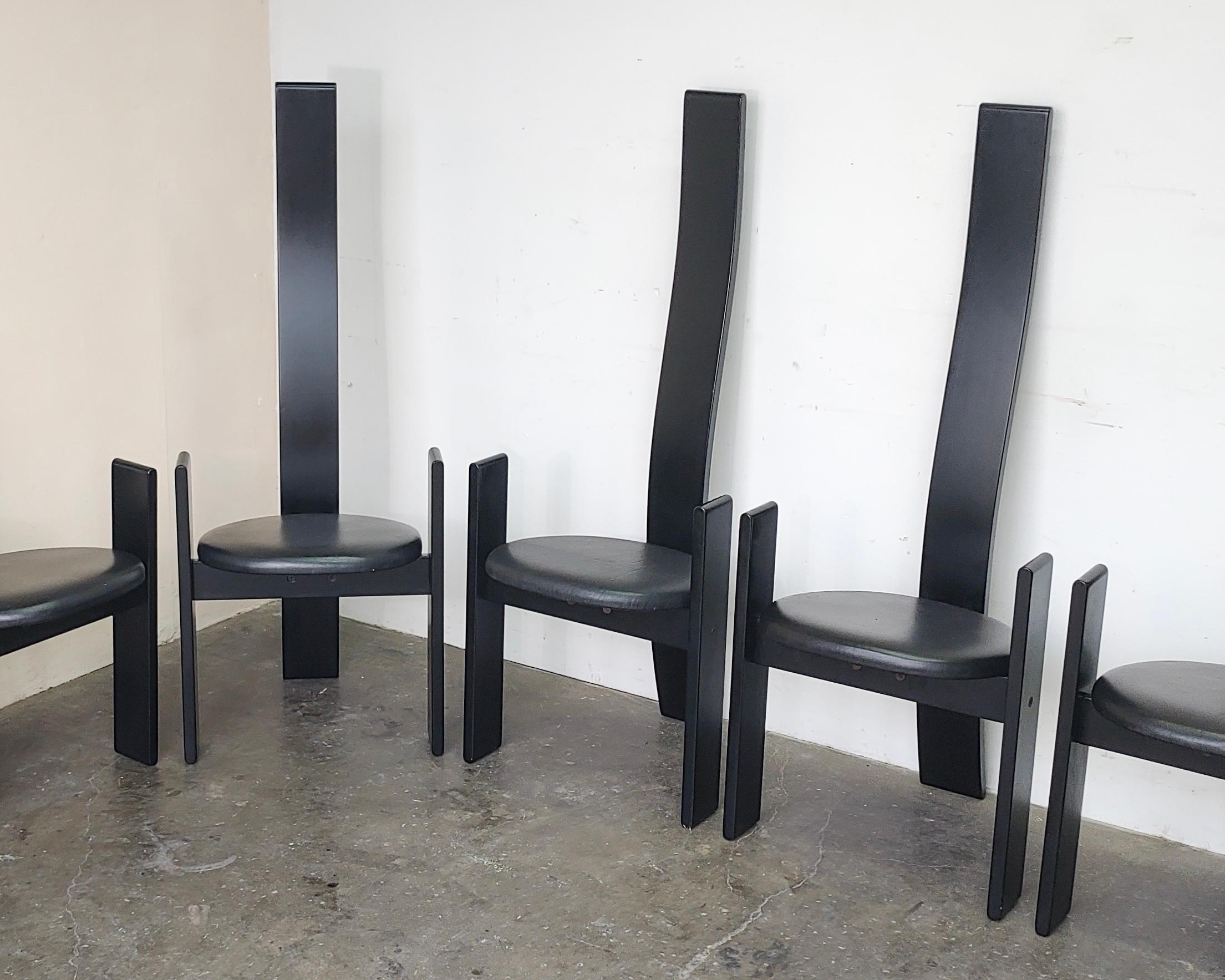 Set of 6 iconic 'Golem' dining chairs designed by Vico Magistretti for Poggi 1969, made in Italy. Black lacquer finish with original vinyl upholstery. Shows some wear and light damage to the finish in some areas, see photos. 

Measures: 19.75