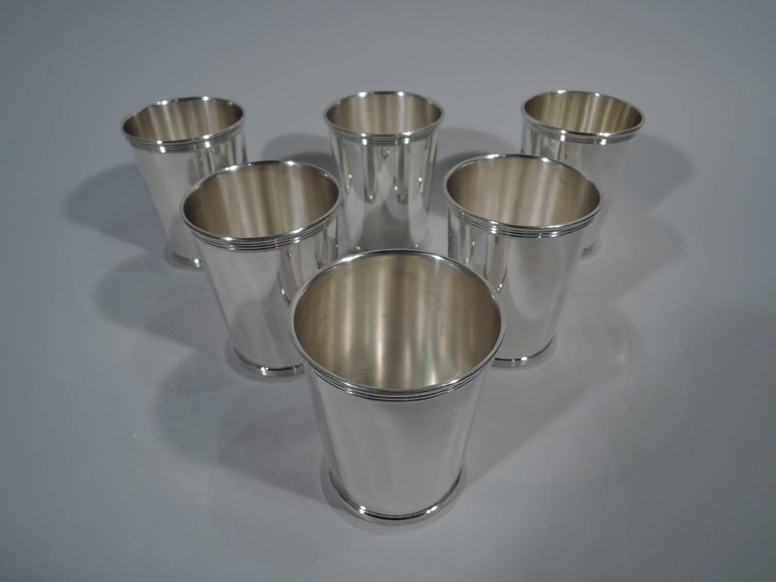 Set of 6 sterling silver mint julep cups. Made by Gorham in Providence. Straight and tapering sides and reeded rim and foot. Hallmarked Newport (a Gorham trademark) with no. 1673. Total weight: 23.6 troy ounces. 