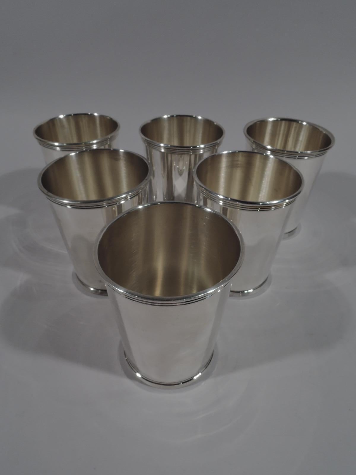 Set of 6 sterling silver mint julep cups. Made by Gorham in Providence. Each: Straight and tapering sides, molded and reeded rim, and reeded foot. Marked “Newport / Sterling 1673”. Newport was a Gorham brand. Total weight: 23 troy ounces.
