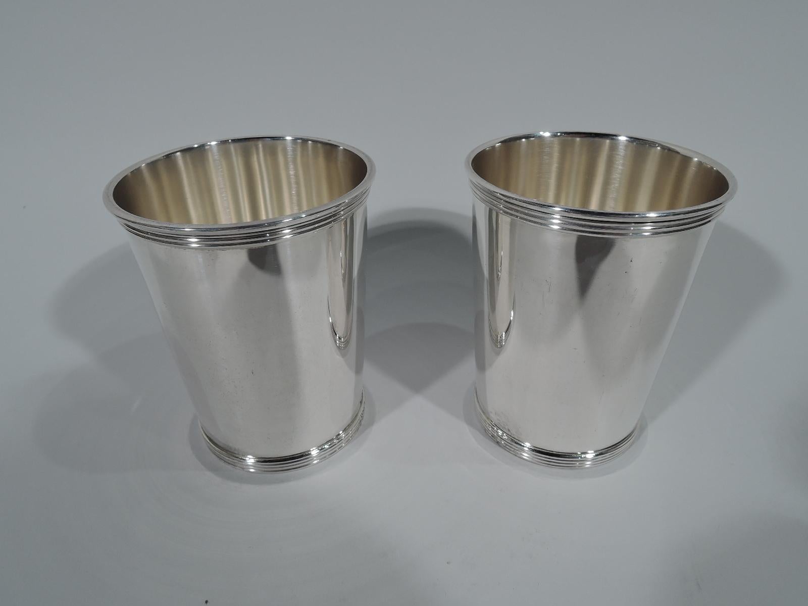 Set of 6 sterling silver mint julep cups. Made by Gorham in Providence. Straight and tapering sides and reeded rim and foot. Hallmarked Newport (a Gorham trademark) with no. 1673. Total weight: 23 troy ounces.