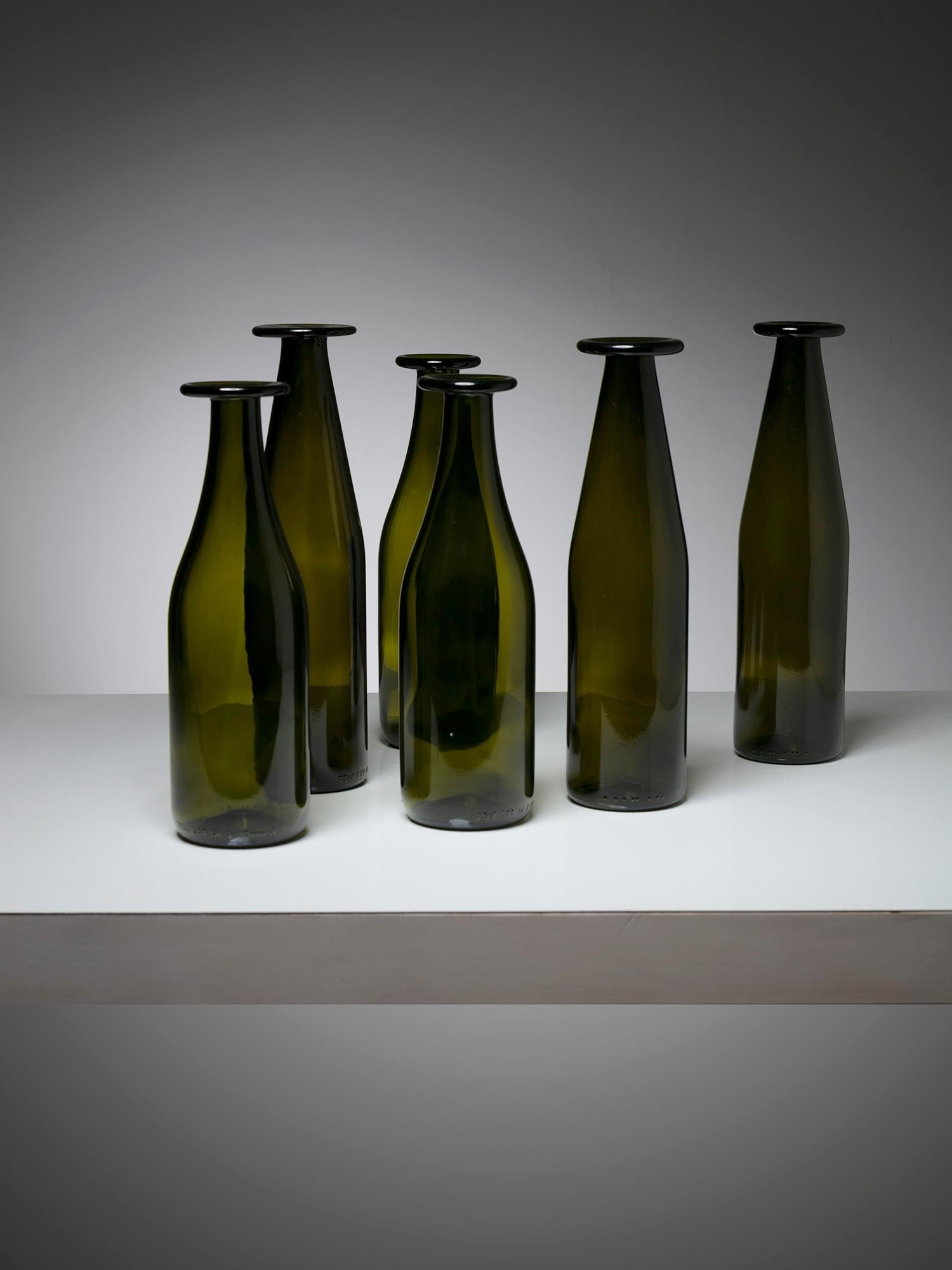 Large set of glass bottles designed by Jasper Morrison for Cappellini.
Different size and color intensity for this daily usable pieces.
Early edition with heavy glass; size refers to the large piece.