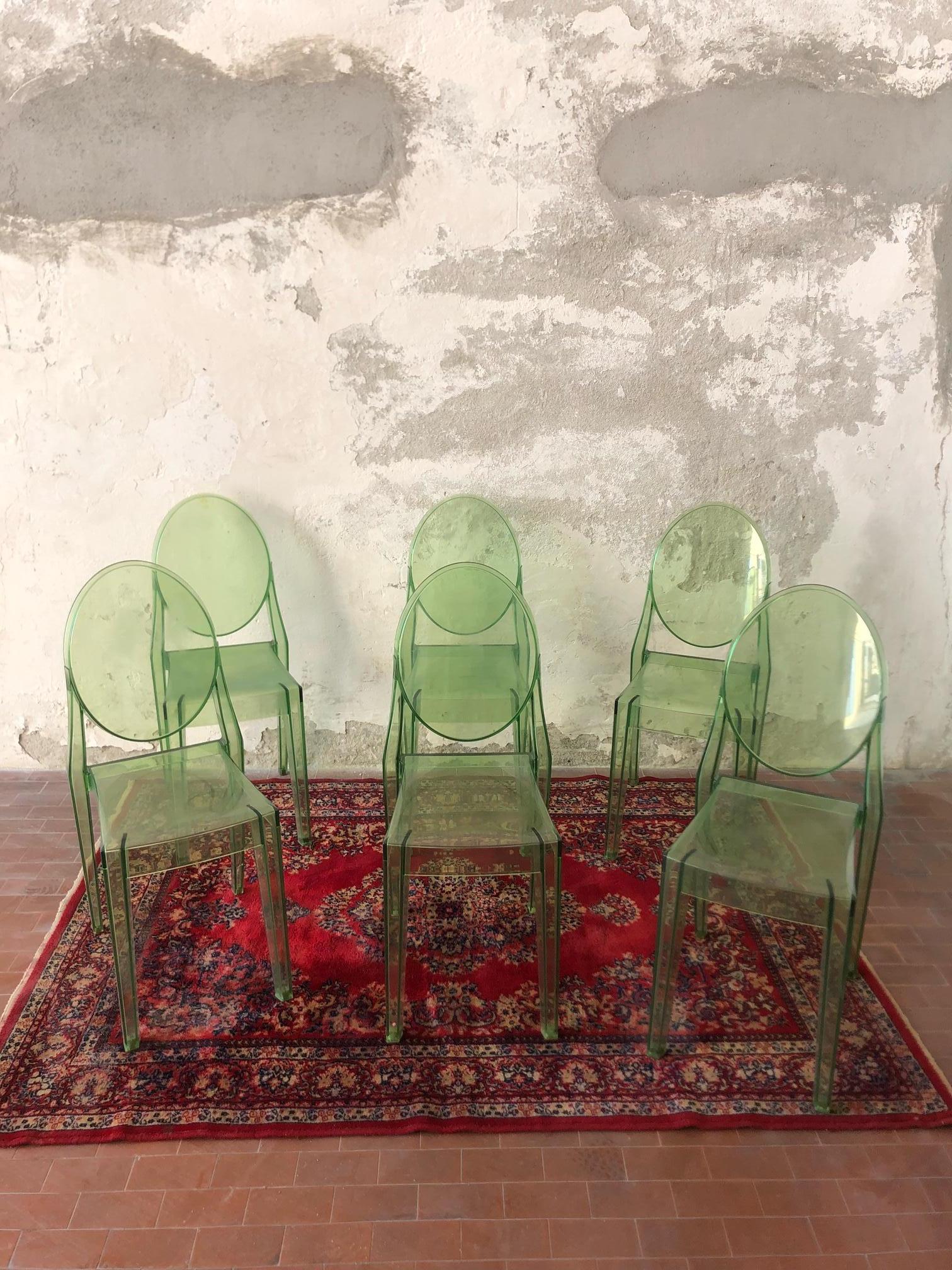 Set of 6 green transparent polycarbonate chairs, designed by Philippe starck and produced by Kartell with the name of Ghost chairs, are a used set with some small scratches from normal wear, sold in sets, ideal for a modern and colorful dining room