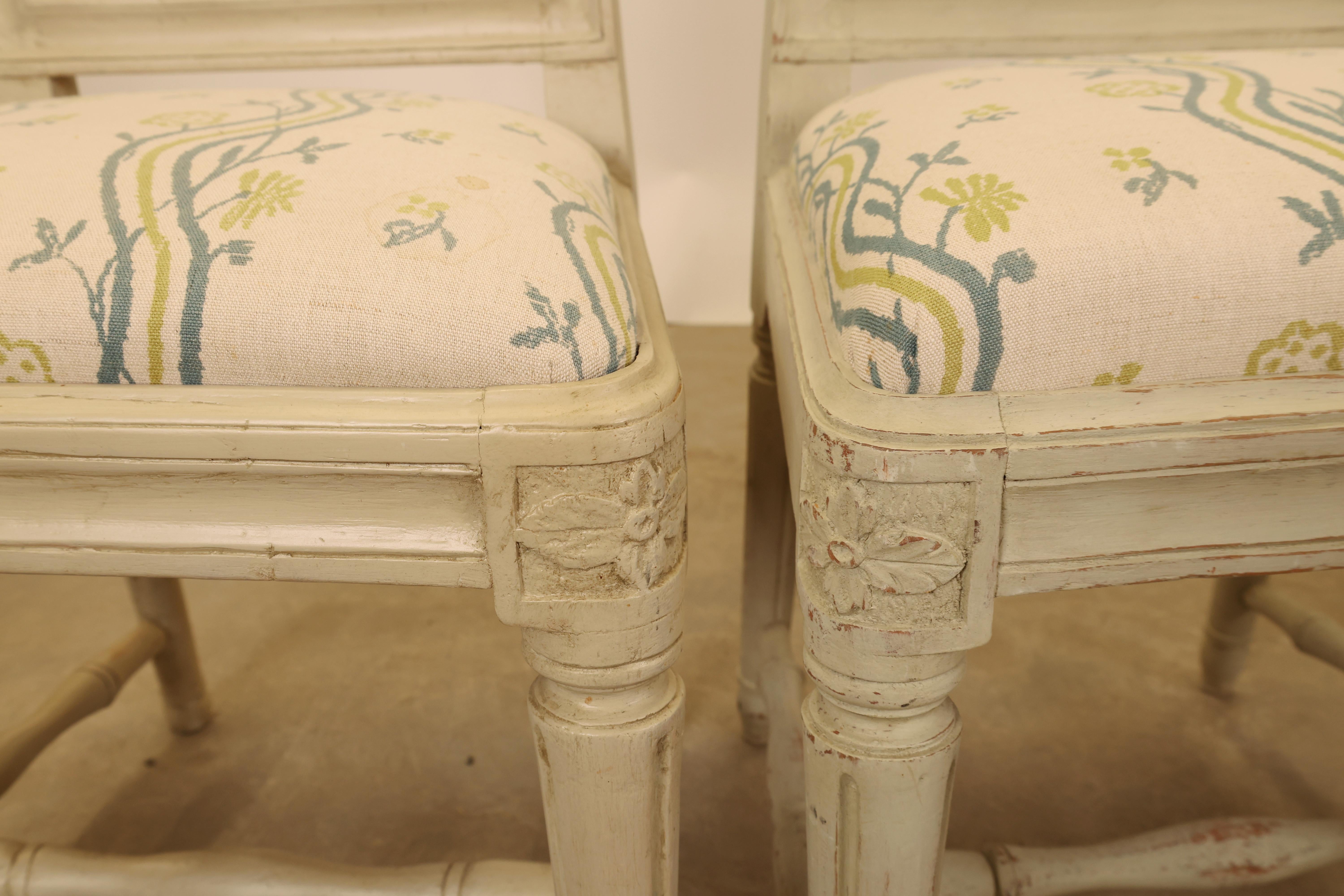 Set of 6 Gustavian chairs. These are Stockholm pieces signed “IHS” by Johan Hammarström (active 1794–1812), with some bearing the label of the Stockholm Chairmaker’s Guild on the frame. The backs feature decorative bundles of interlinked spindles.