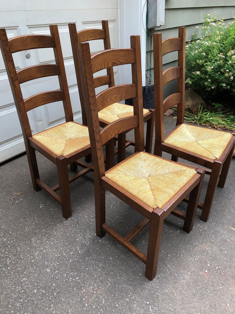 Set of 6 beautifully made ladder back oak dining chairs stamped Pieracci, Made in Italy.  Seats are rush.  Very sturdy and comfortable chairs.
