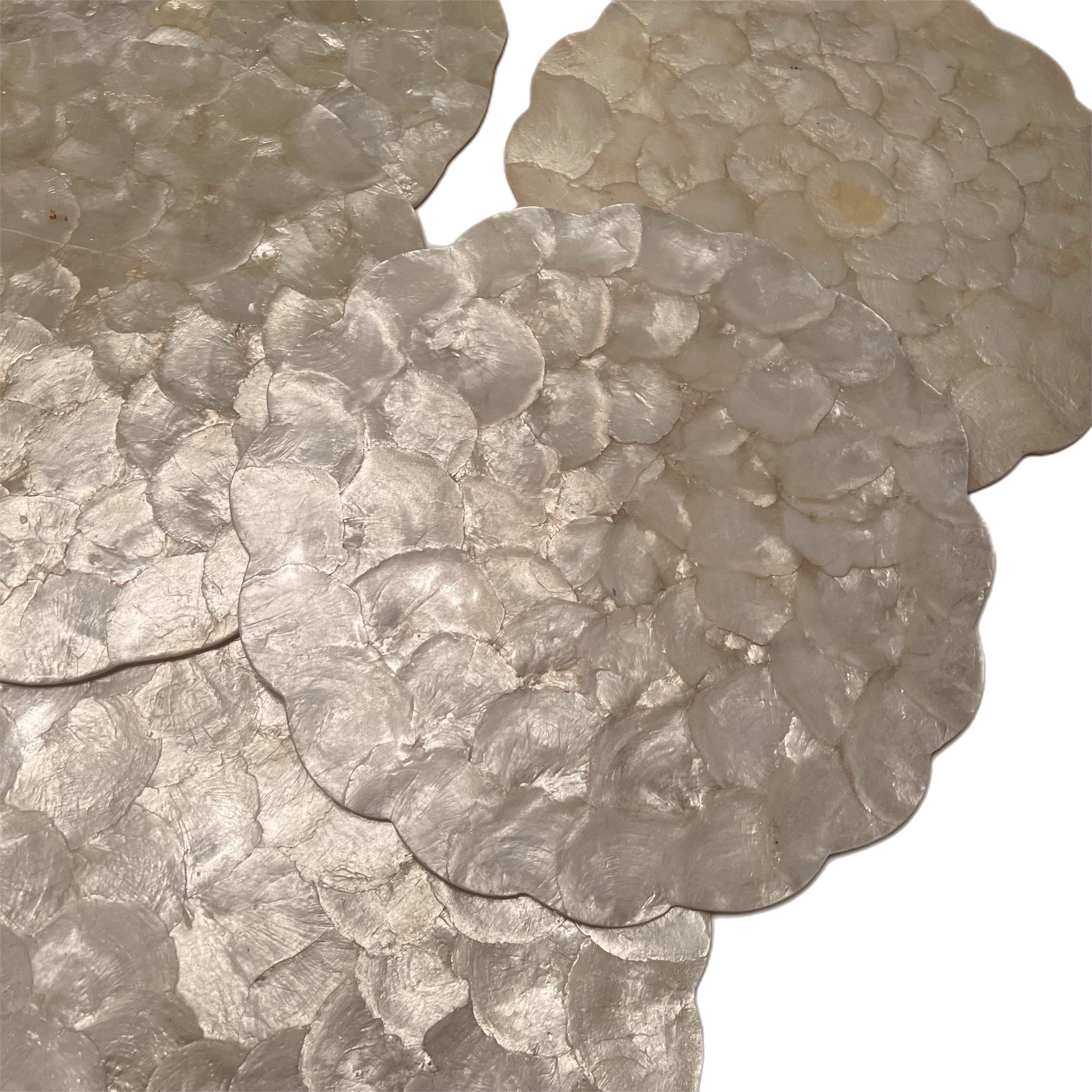 Set of six capiz pearl shell scalloped edge circular placemats with a Luminous, beautiful pearl shell color.