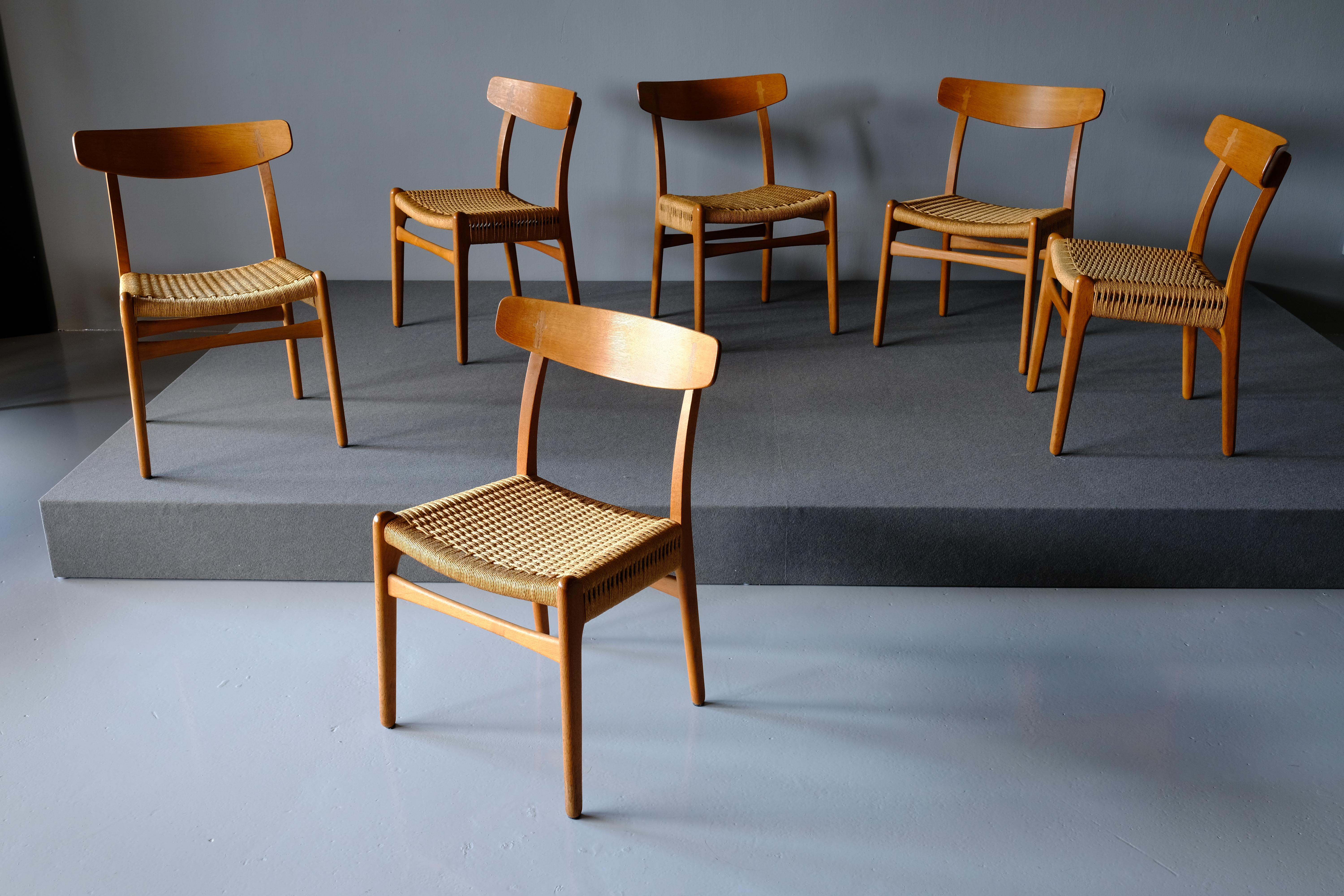 Set of 6 dining chairs, CH 23 by Hans Wegner for Carl Hansen & Son . The CH 23 is an early example of Wegner’s signature style and impeccable craftsmanship. It was one of the 5 pieces of furniture designed exclusively for Carl Hansen & Son in 1950.