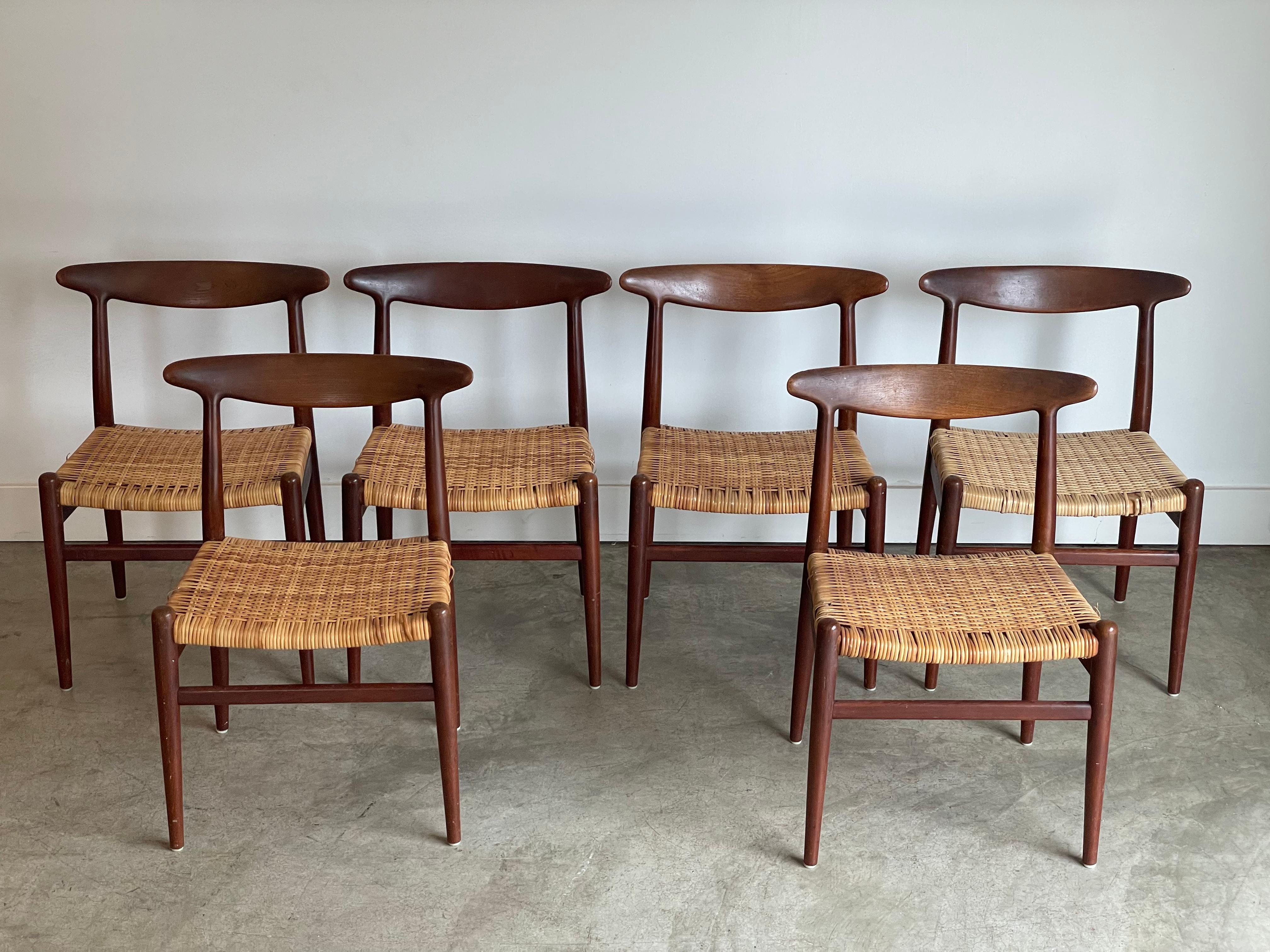 Pair of “The Chair” Hans Wegner armchairs.