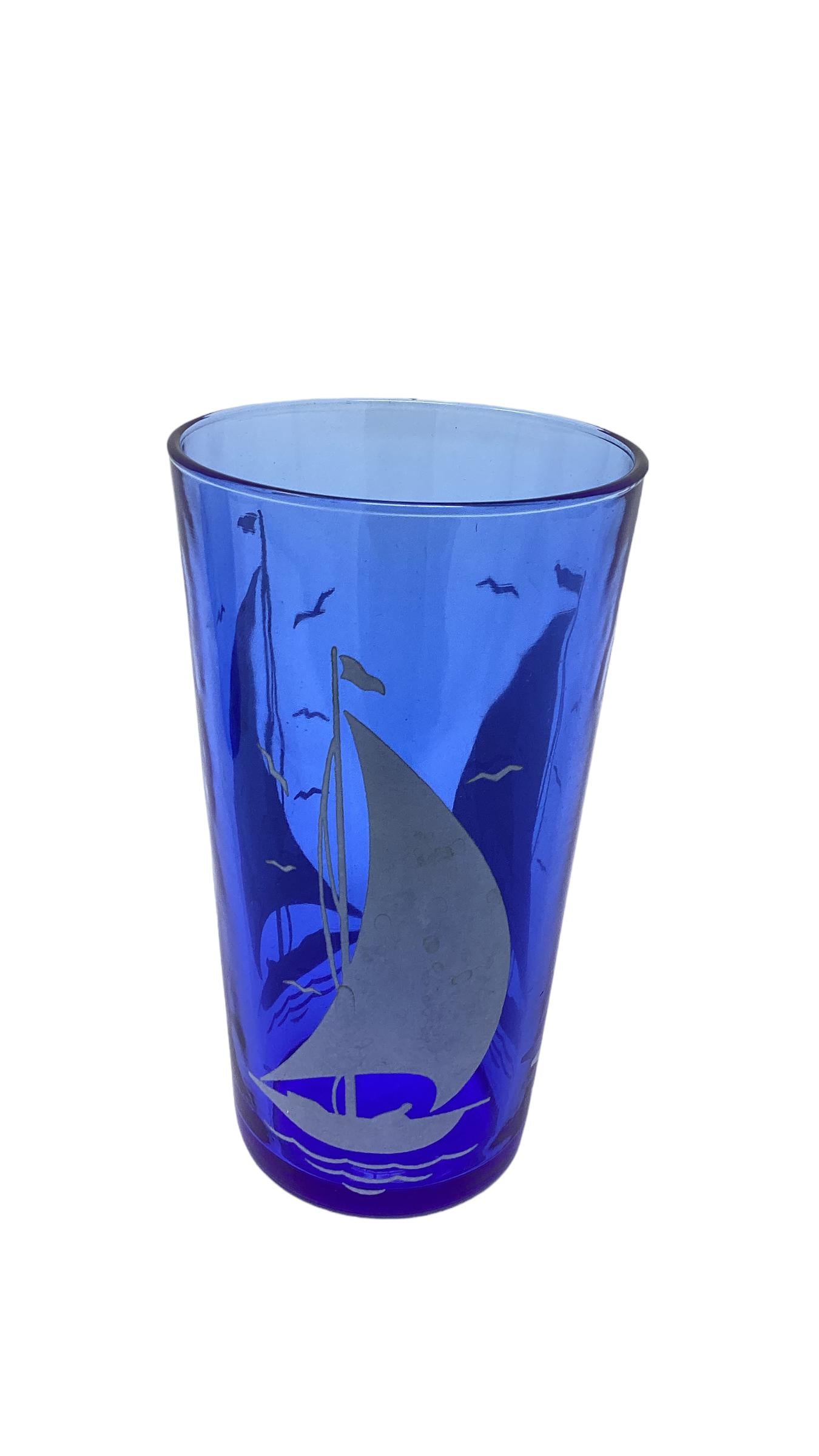 Art Deco cobalt blue glass tumblers with white sailboats from the Sportsman Series by Hazel-Atlas Glassware.
