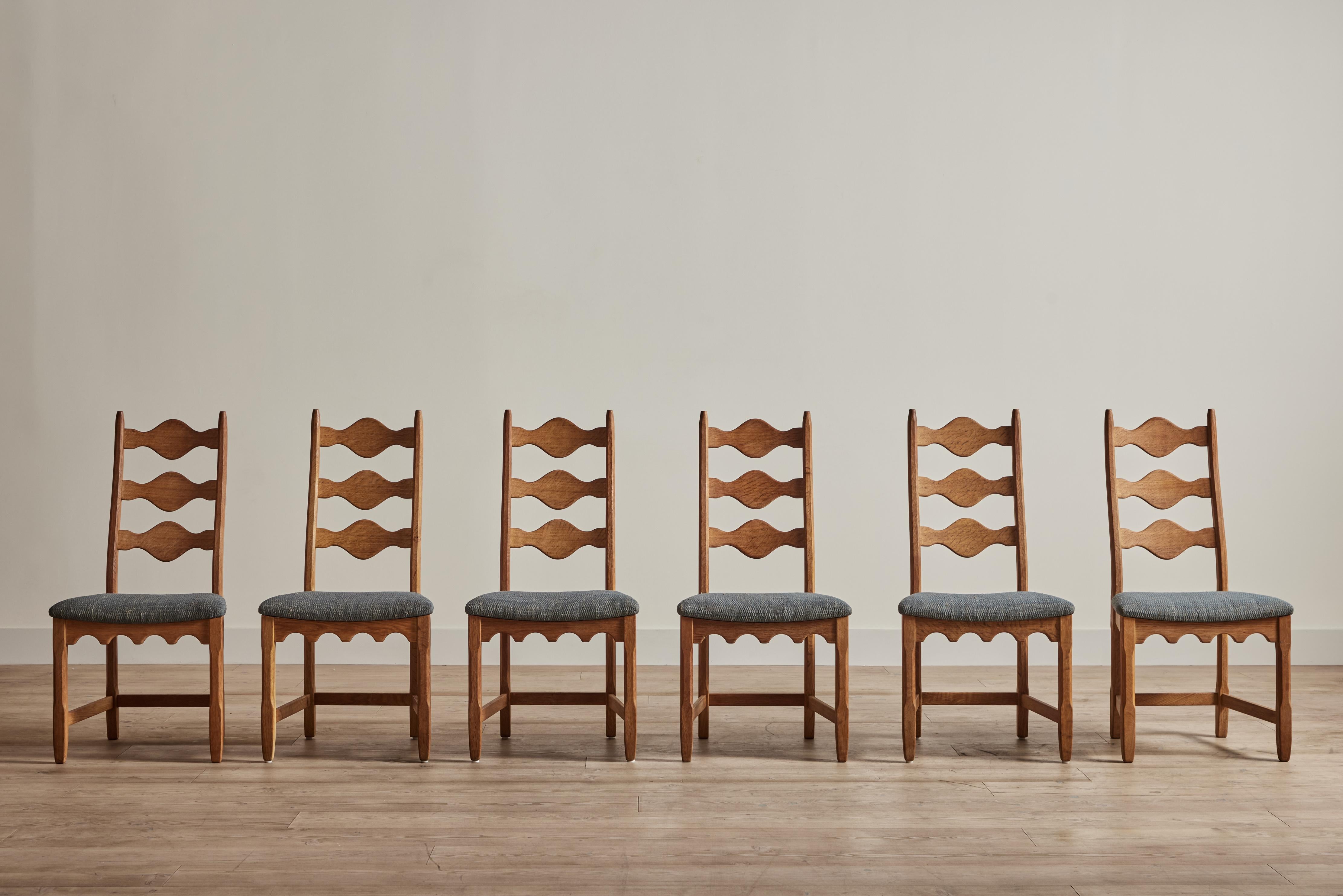 Set of six 1960s ladderback dining chairs attributed to Danish designer Henning Kjaernulf. These chairs have been newly upholstered in Pat McGann fabric.