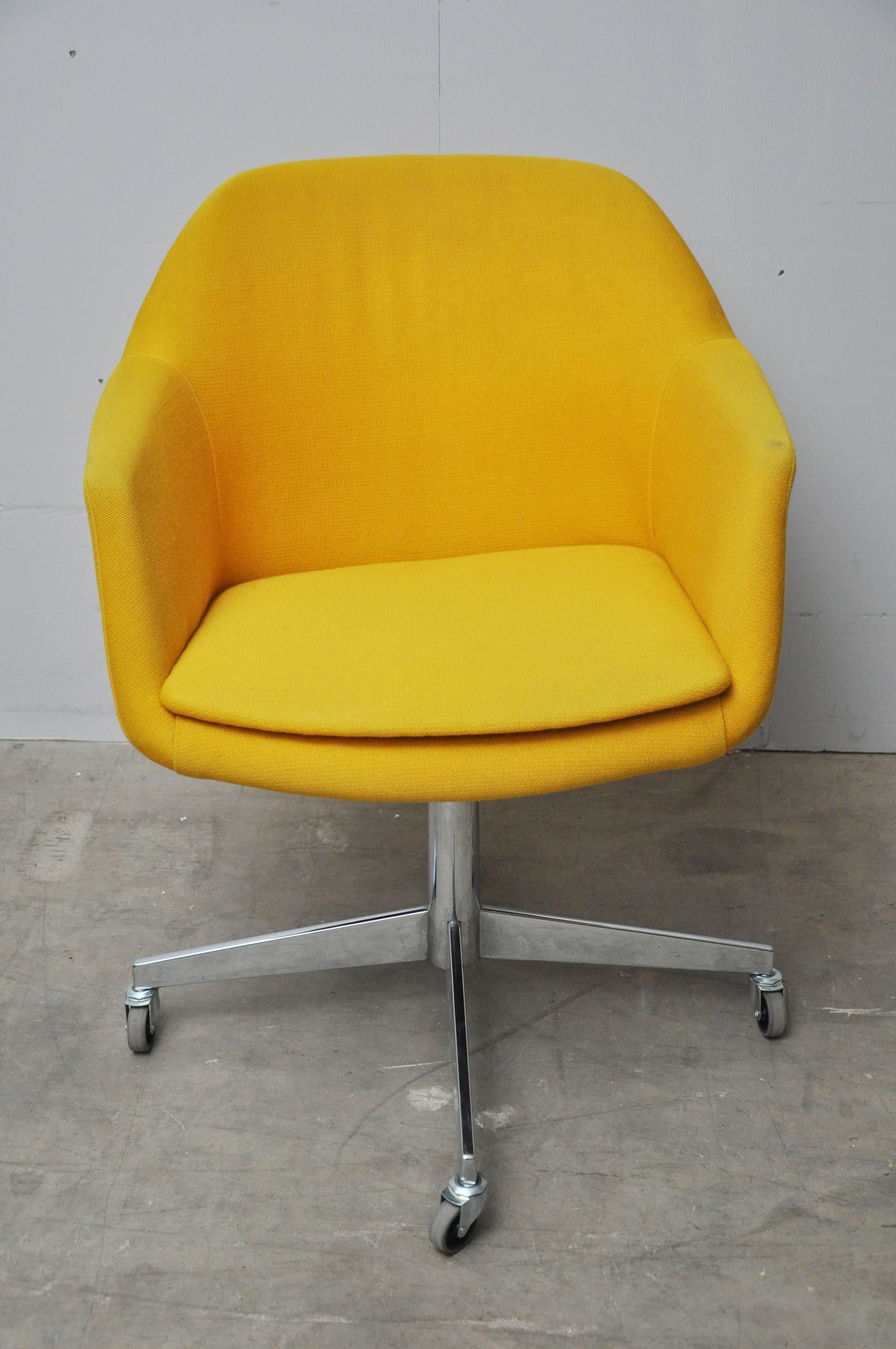 Canary yellow upholstered armchairs.