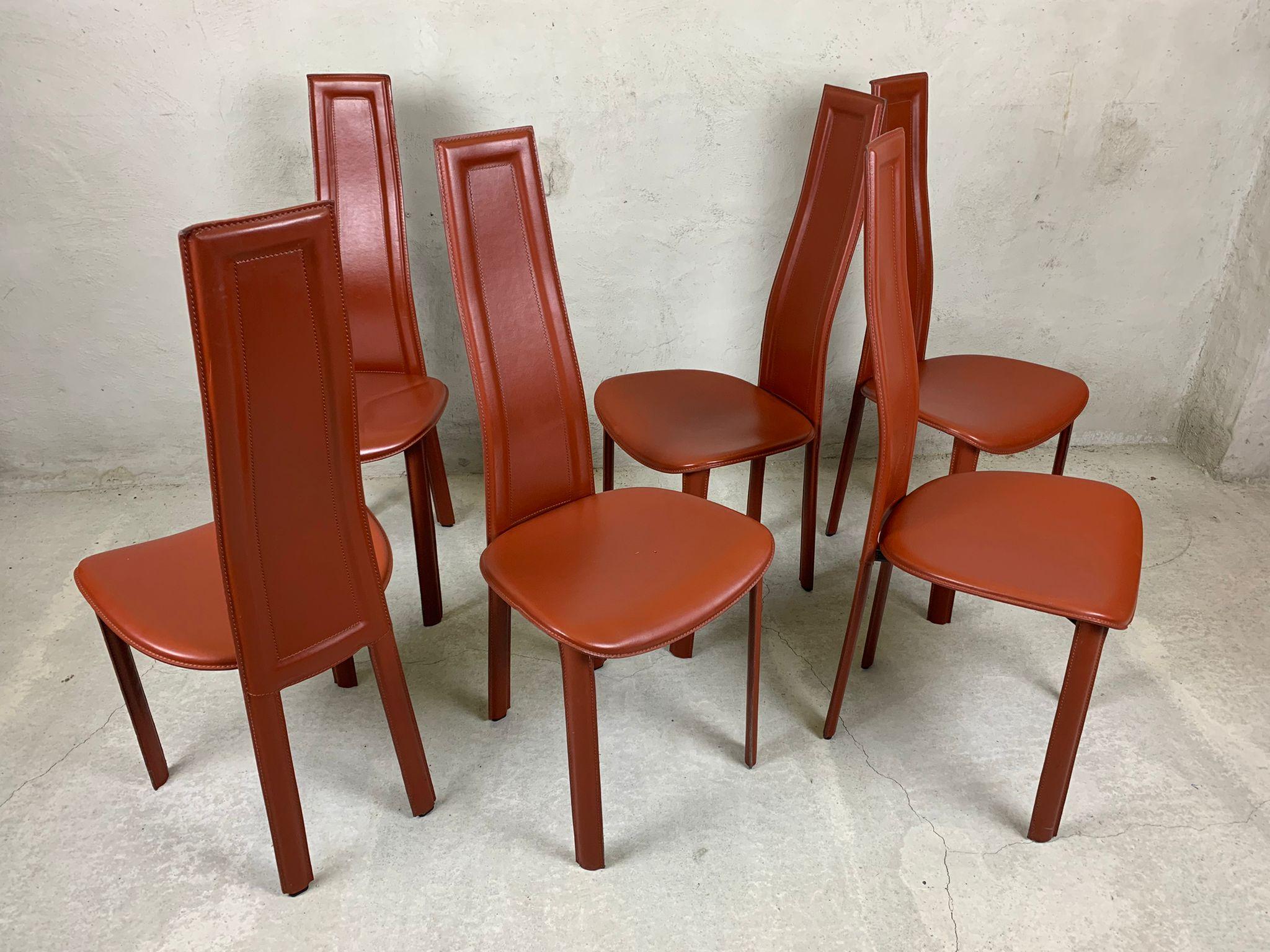 Set of 6 cognac leather high back dining chairs.

beautiful sleek and timeless design.

The chairs are in fair condition with minimal wear.

1980s - Italy

Dimensions
height: 110cm/43.30
