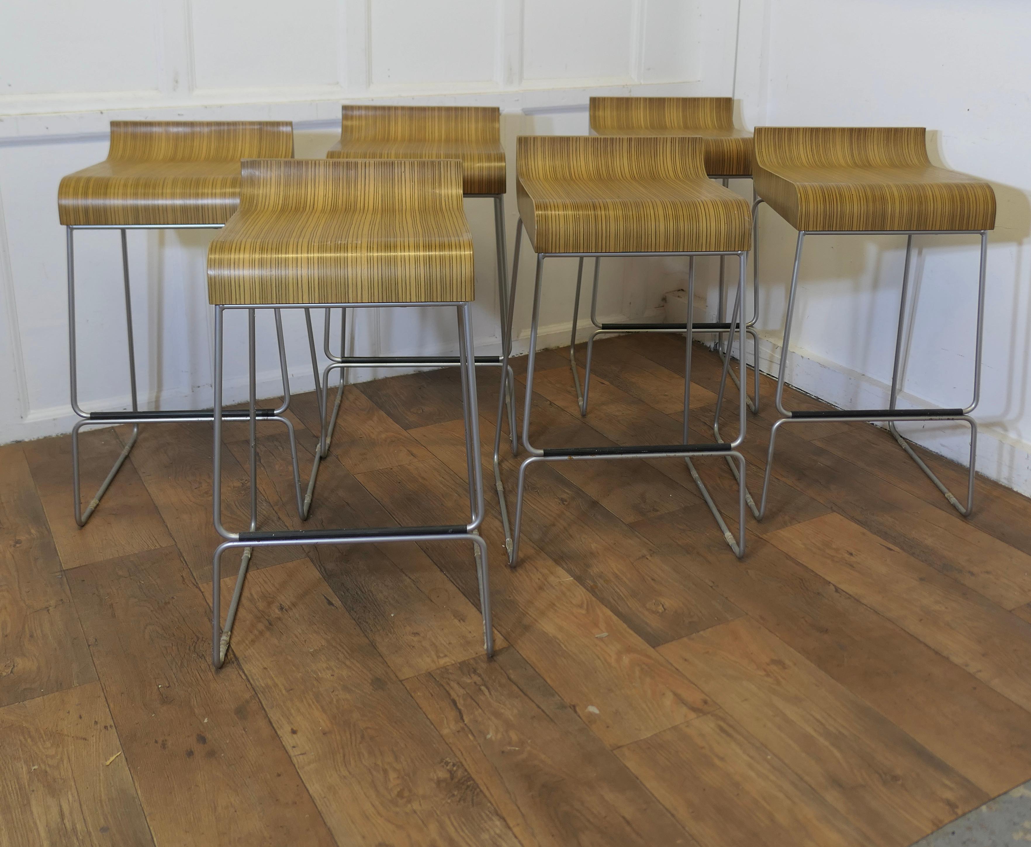 Set of 6 High Class Italian Bar Stools by Emilio Nanni  

Superb design a set of 6 Chrome and Zebra Wood Breakfast bar seats manufactured by Calligaris, the stools were made in the 1950s, they are in very good condition, they have only very slight