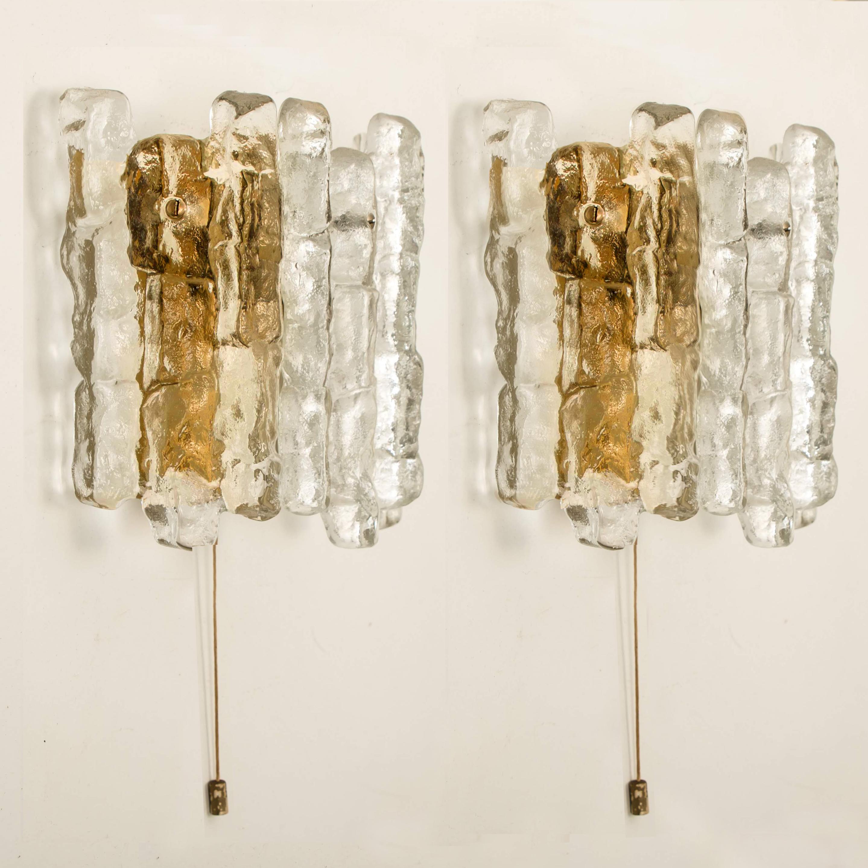 Set of 6 beautiful and elegant modern brass toned wall lights or sconces, manufactured by J.T. Kalmar Austria in the 1970s. Lovely design, executed to a very high standard. 

Each wall light has three solid ice glass sheets dangling on it. Clean