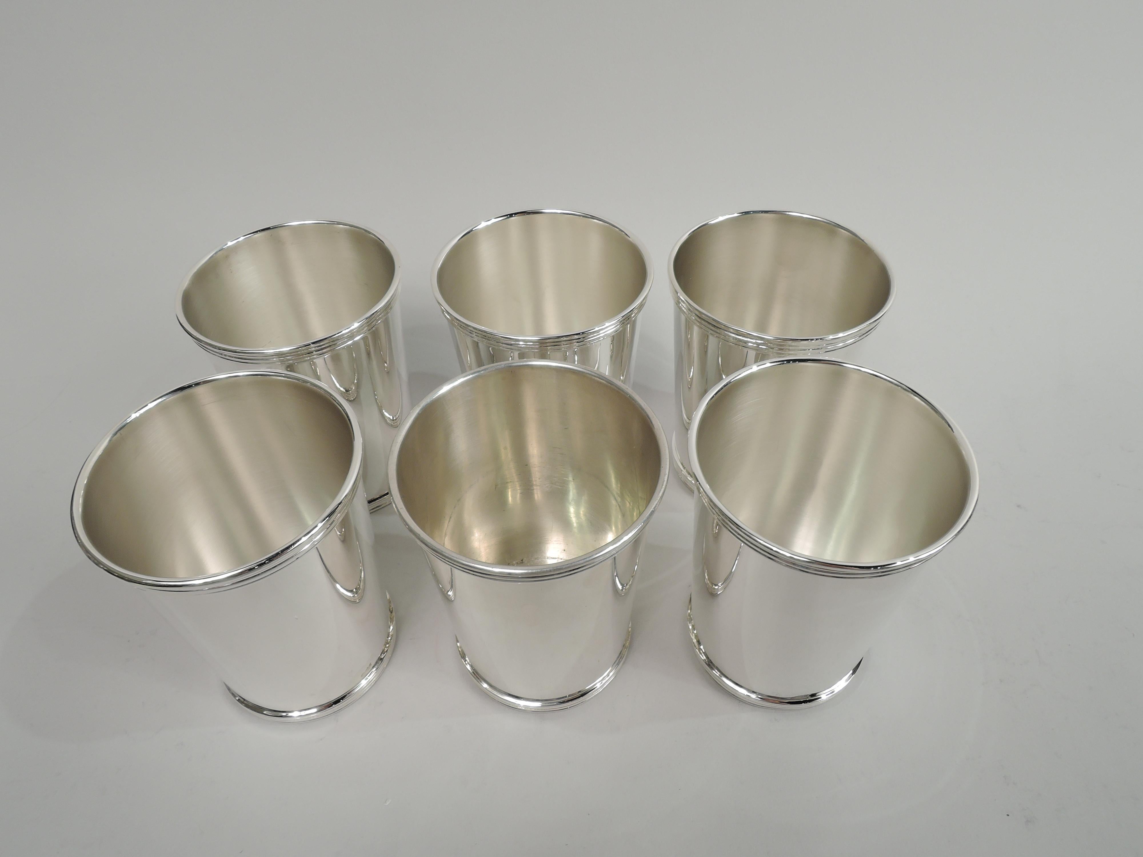 Set of 6 sterling silver mint julep cups. Made by International in Meriden, Conn. Each: Straight and tapering sides, and reeded rim and base. Fully marked including maker’s stamp, no. 10125/1. Total weight: 23 troy ounces.