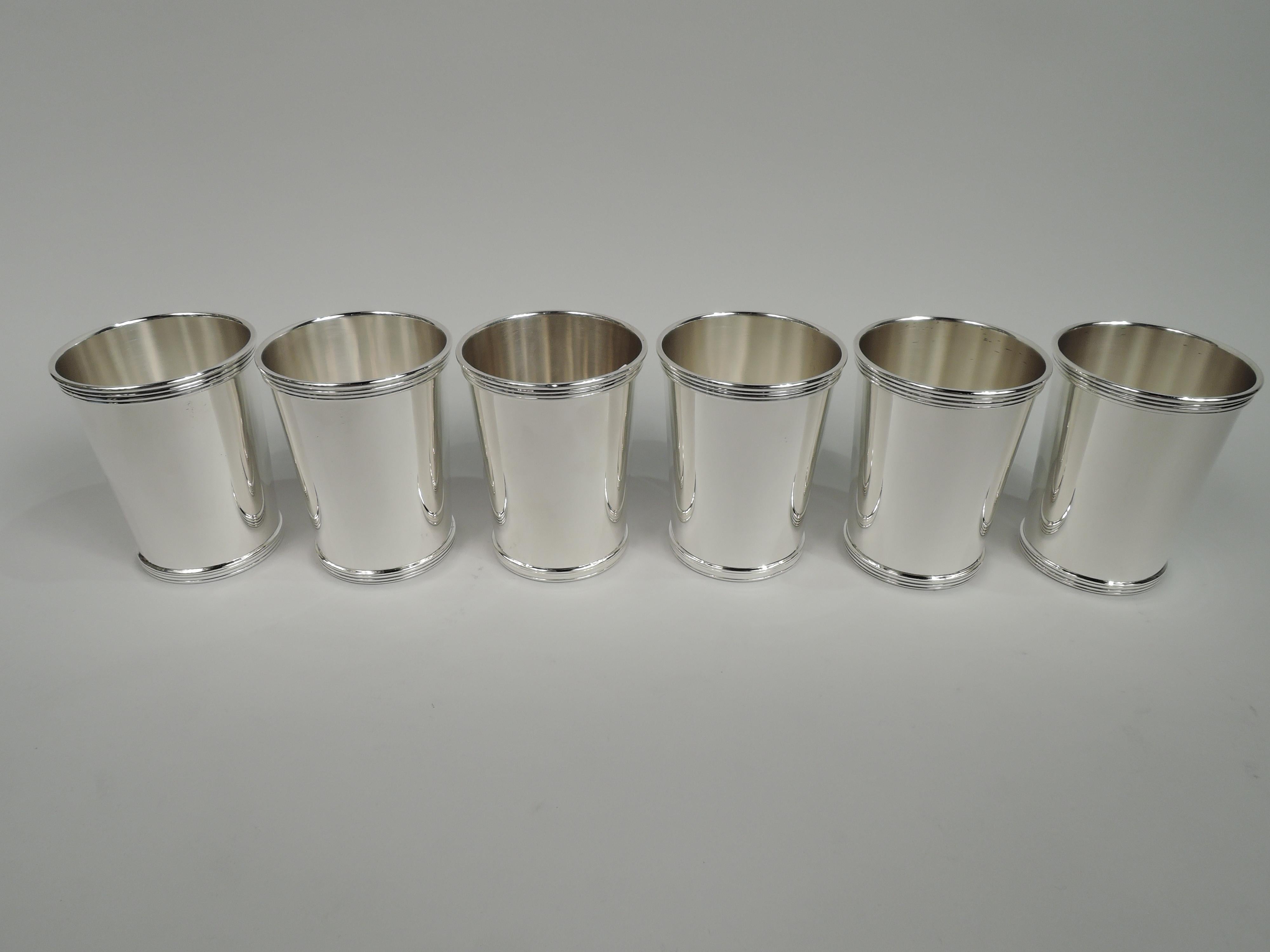 Set of 6 sterling silver mint julep cups. Made by International Silver Co. in Meriden, Conn. Each: Straight and tapering sides, and reeded rim and base. Fully marked including maker’s stamp and no. 10125/1. Total weight: 23.5 troy ounces.