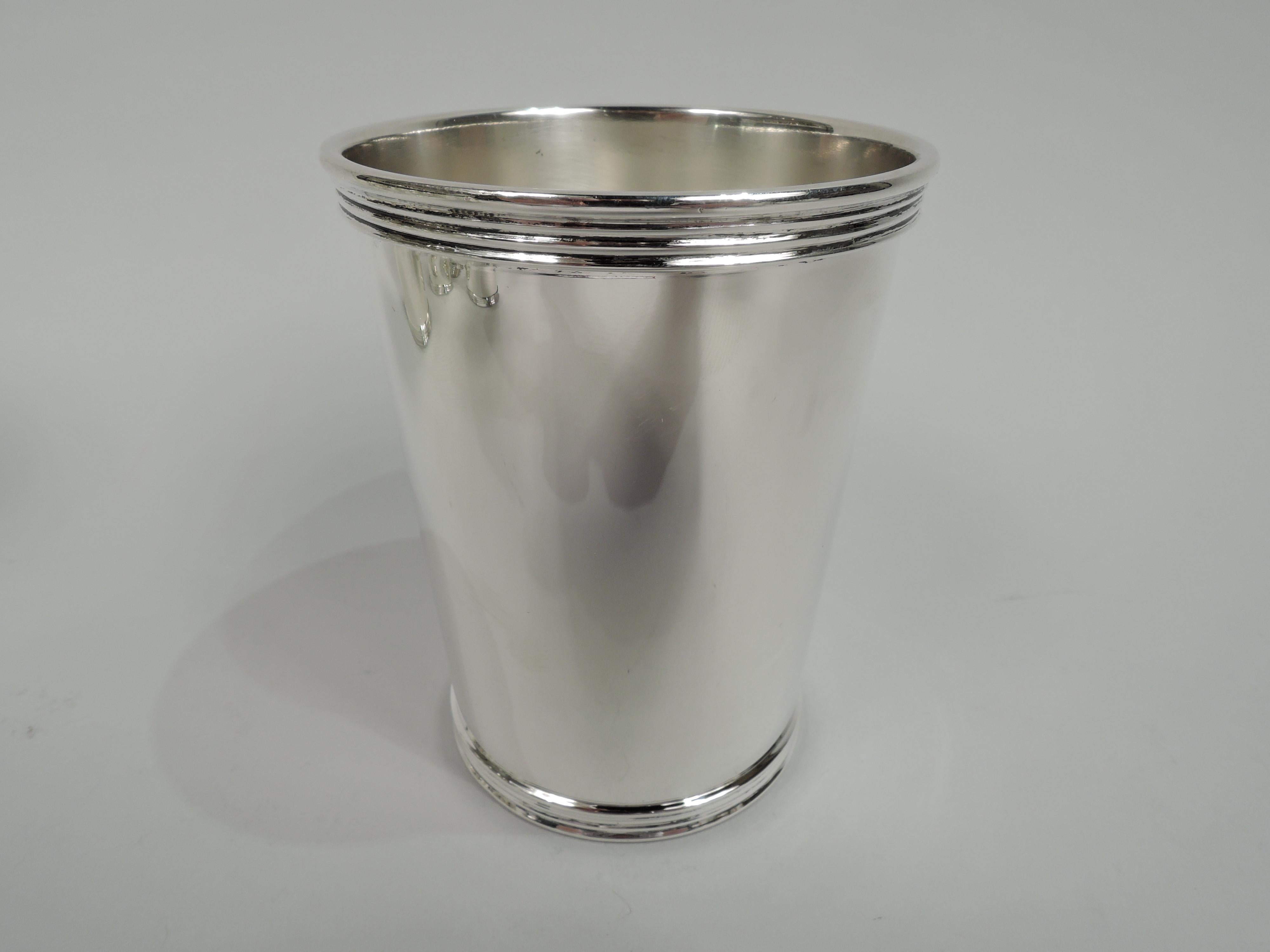 Set of 6 traditional sterling silver mint juleps. Made by International Silver Co. in Meriden, Conn. Each: Straight and tapering sides, and reeded rim and base. Fully marked including maker’s stamp and no. P699. Total weight: 24 troy ounces.