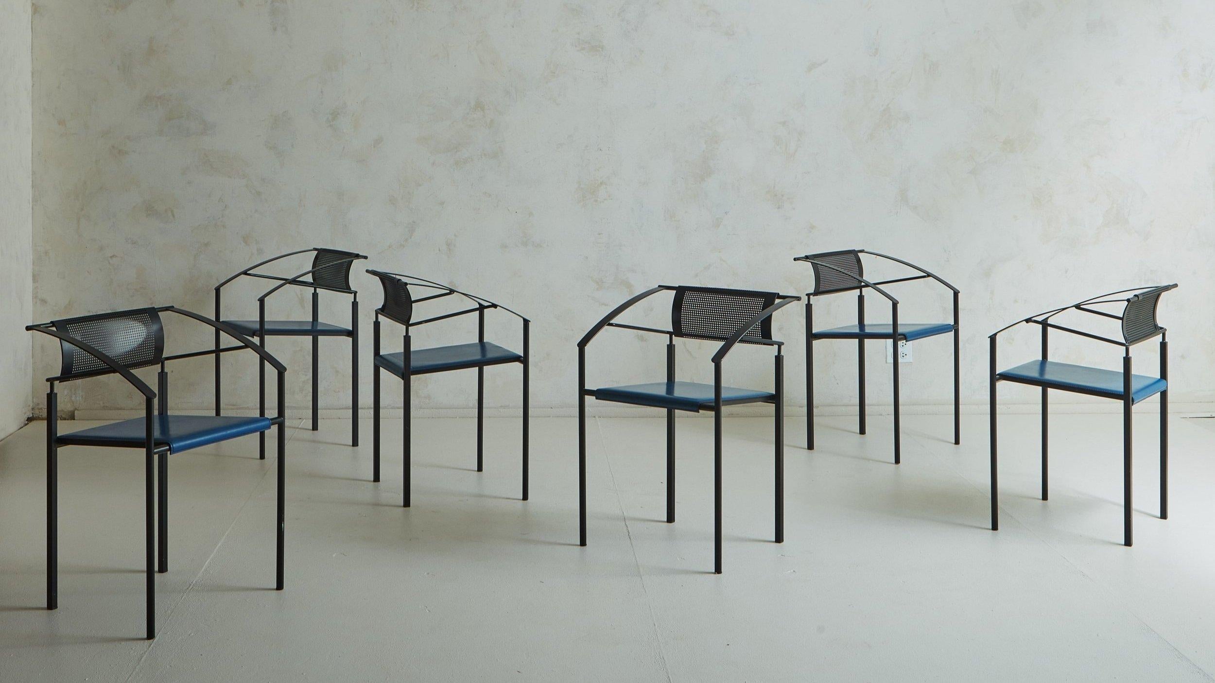 A set of 6 postmodern Italian ‘Carrè VI’ chairs by Fly Line. These striking chairs feature black iron frames with angular arms, tubular legs and curved rectangular perforated metal seat backs. They retain their original blue leather seats with