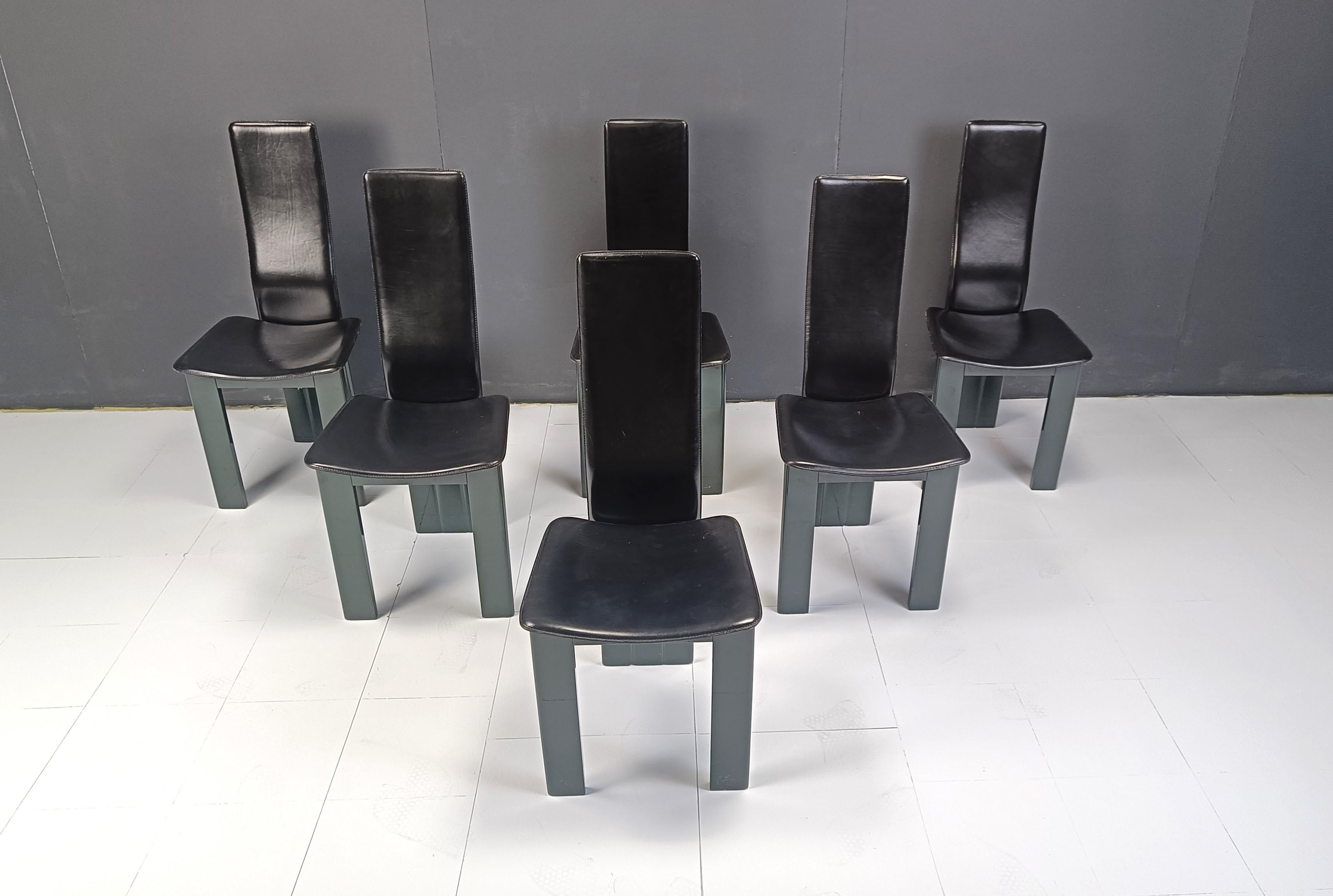 
Postmodern black leather dining chairs with Green lacquer bases.

Unique set we've never seen before.

Very good quality, timeless design and a nice dark green lacquer wood.

1980s - Italy

Dimensions
Height: 105cm
Width: 45cm
Depth: 45cm
Seat