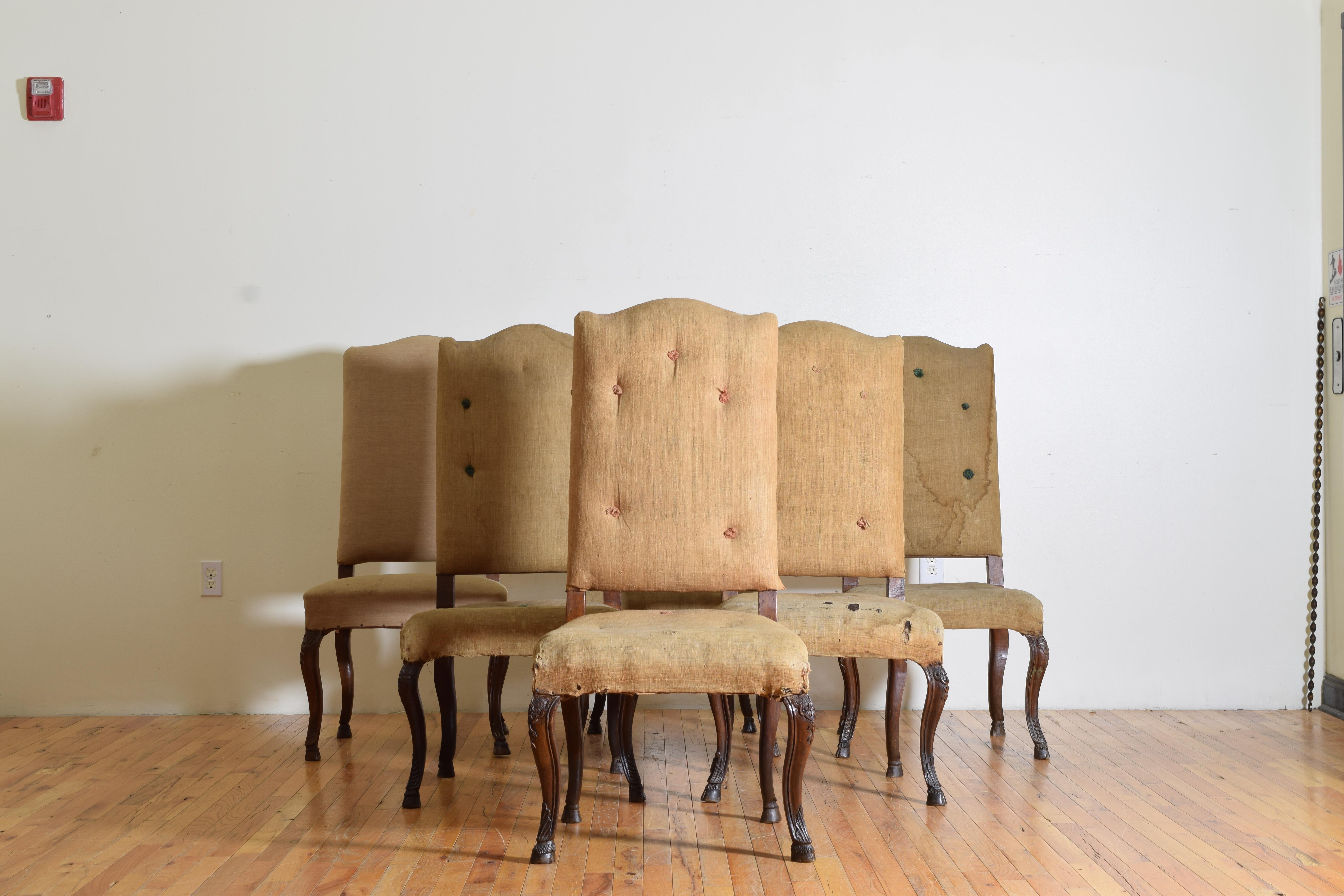 Having serpentine shaped backrests and generous fitted seats these chairs exhibit beautifully shaped and carved legs terminating in deer hoof feet, sizable and comfortable dining chairs.
