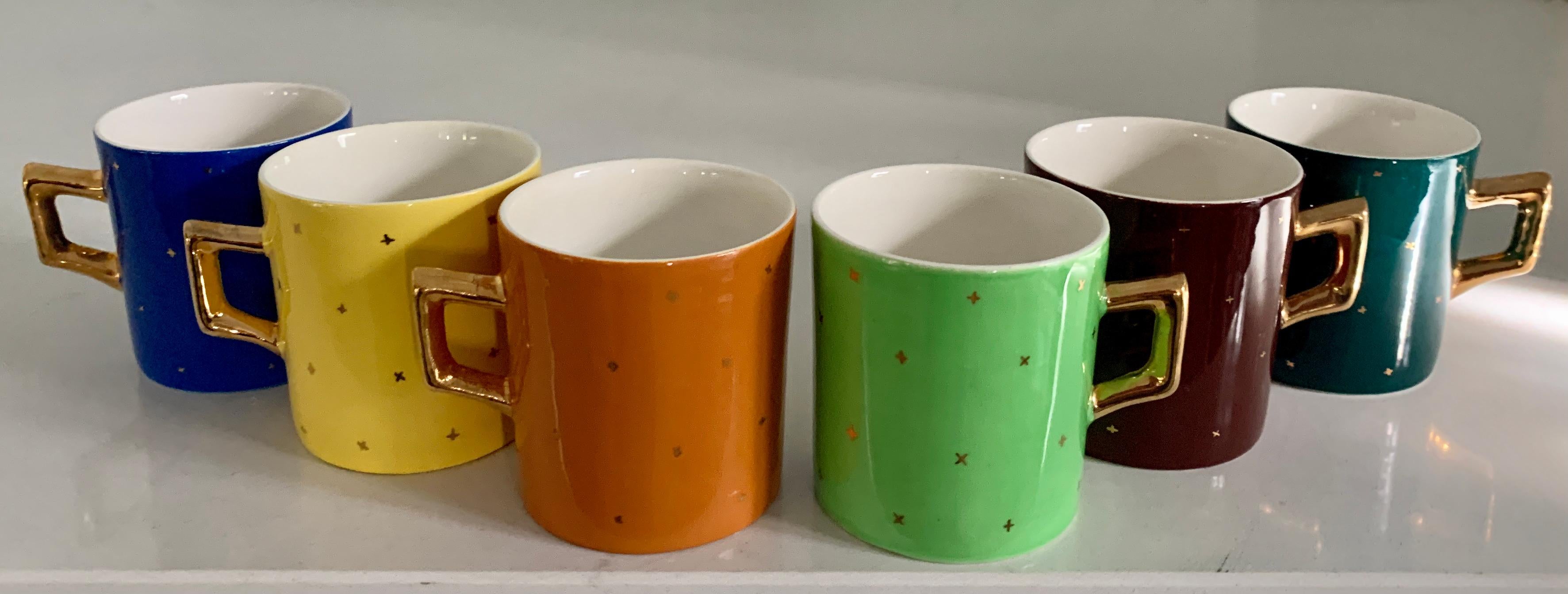 A set of 6 Espresso cups. The set are Italian and in wonderful colors (so your guests never are confused about which espresso is intended for them). Each cup is of a different color and all contain a star pattern. A great house warming gift, holiday