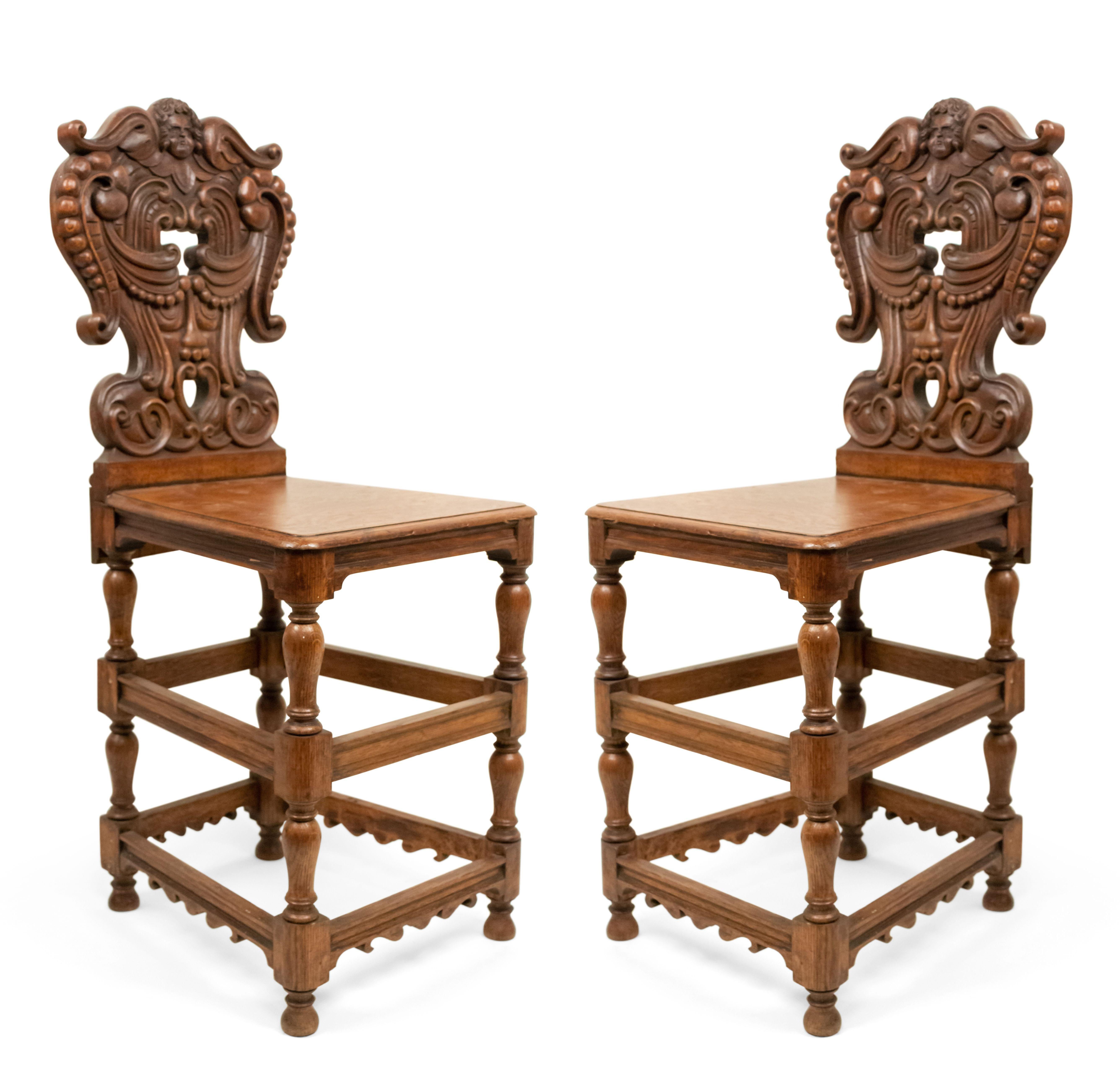 Set of 6 Italian Renaissance style (19th Cent) oak 4 legged sgabelli with double stretcher and carved back with cupid head.
