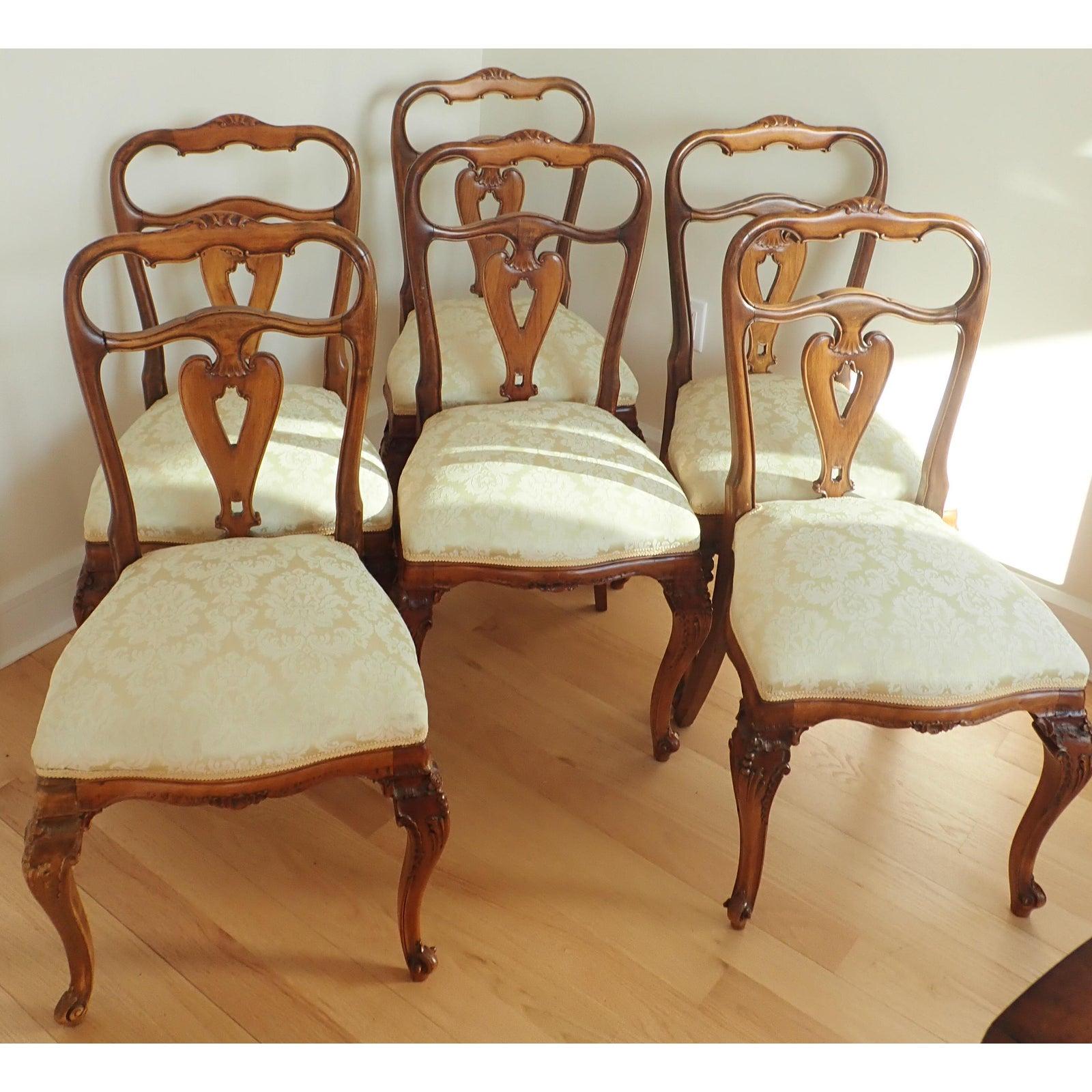 Set of 6 Italian Walnut  Rococo Dining Room Chairs
Hand carved walnut . 19th Century.
Later damask upholstery.

