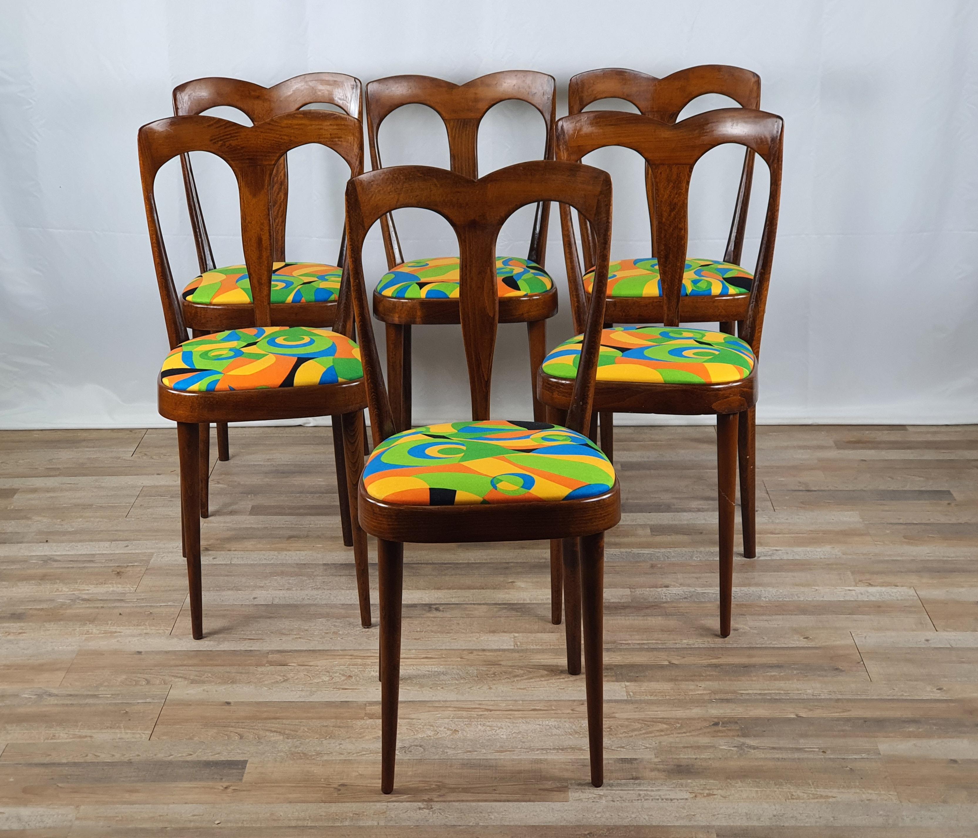 Set of six elegant early 1950s Italian wooden chairs with upholstered seat, ideal for antique or modern dining rooms with a one of a kind contrast.

The chairs have been polished with oil and shellac while the seats have all been reupholstered
