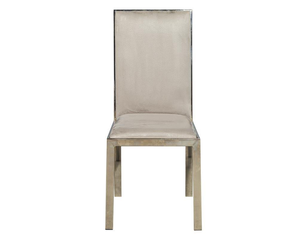 Set of 6 Italian vintage Mid-Century Modern brass dining chairs. Sleek Italian Mid-Century Modern designed chairs in a patinated light brass finish. These chairs have been recently upholstered in a granite gray ultra suede. In excellent original