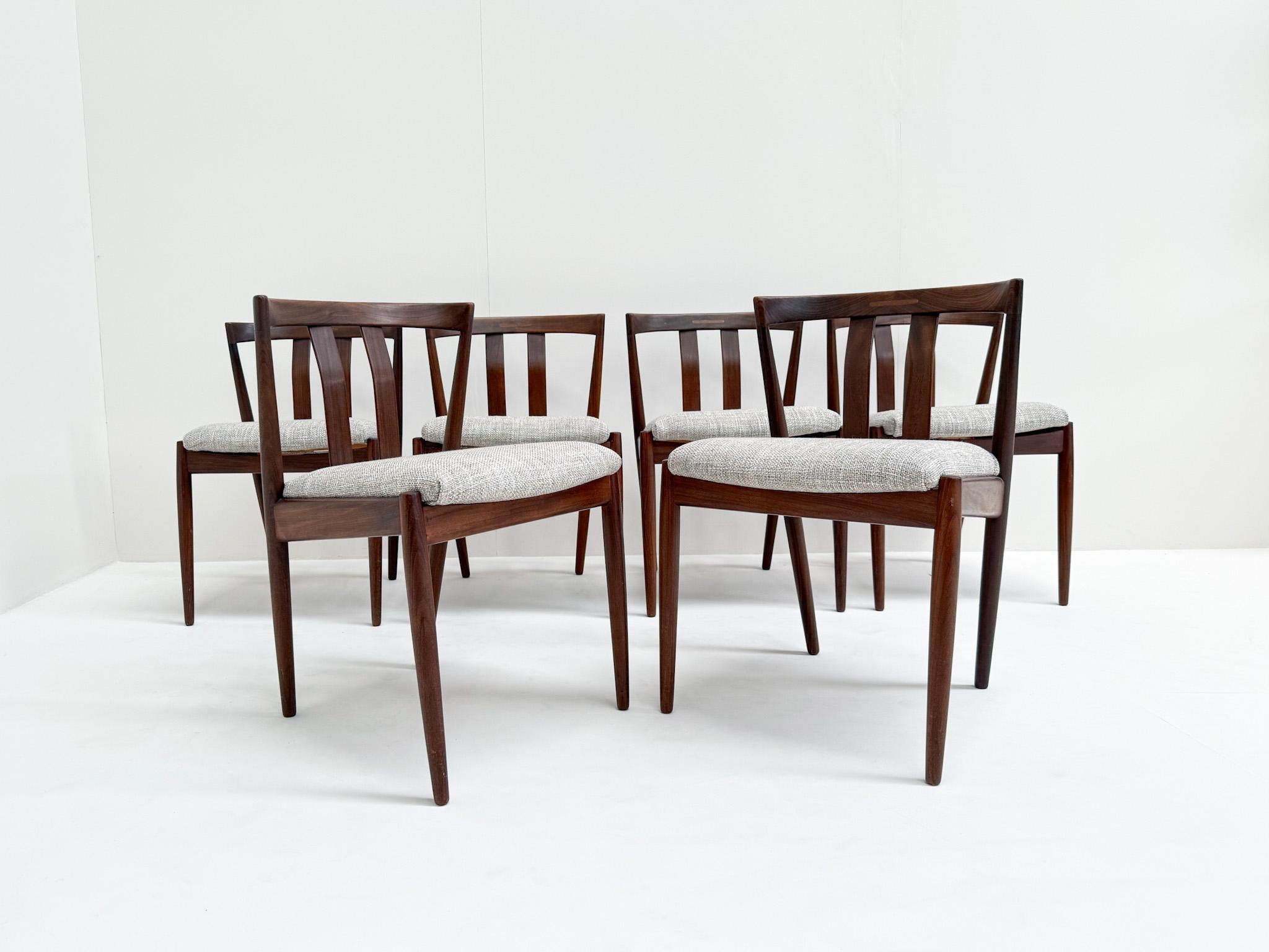 Rare set of six dining chairs designed by Kai Kristiansen in the 1960s. These elegant Danish modern chairs are crafted in solid teak and feature Kristiansen’s characteristic sculptural lines and refined joinery. The seats have been newly upholstered