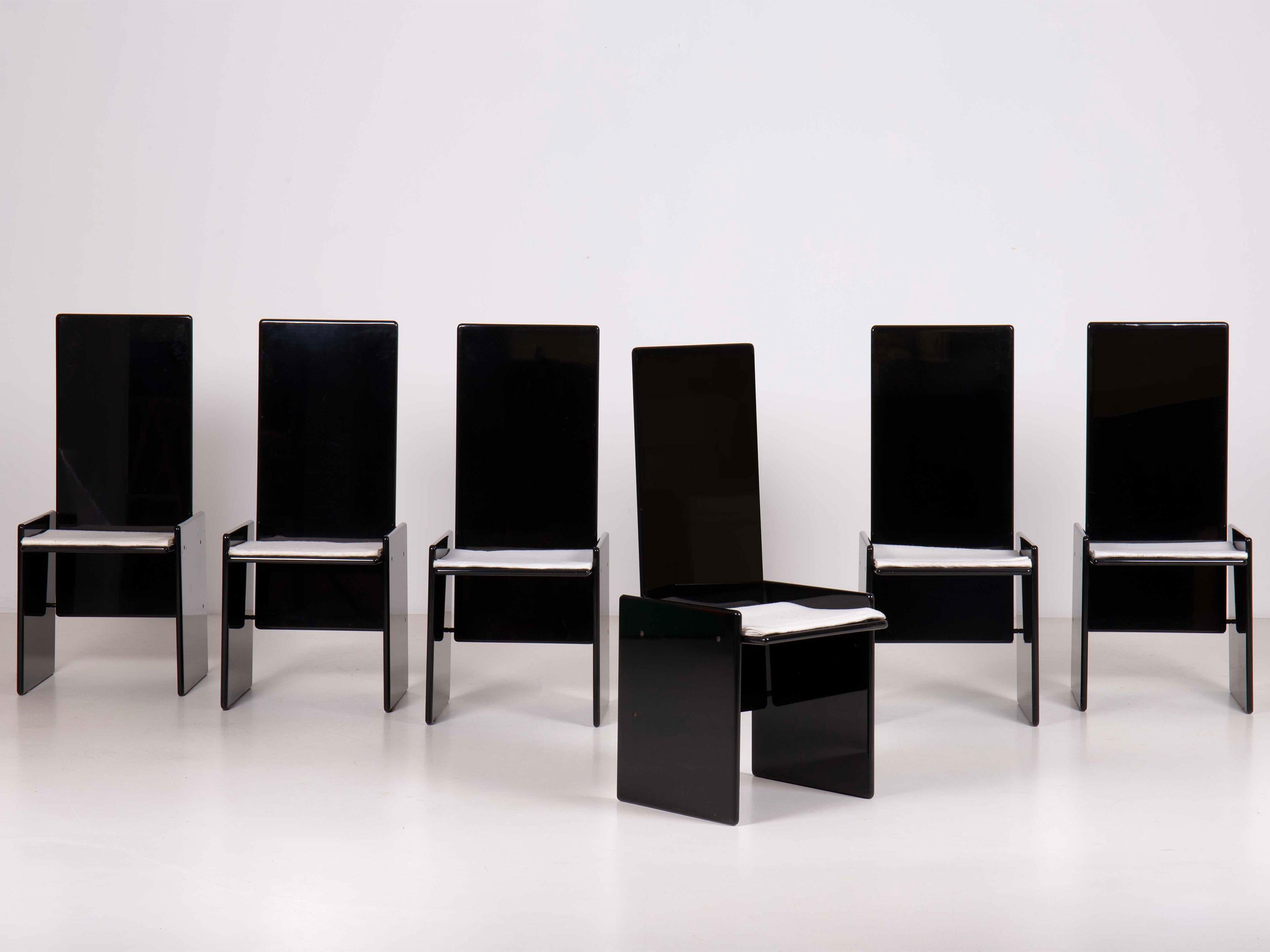 Set of 6 Kazuki chairs designed by Kazuhide Takahama.
Structure in glossy lacquered wood, seat cushion in felt folded as the ancient Greeks used to.
The first glossy lacquered modern mass-produced piece of furniture; a timeless chair with slightly