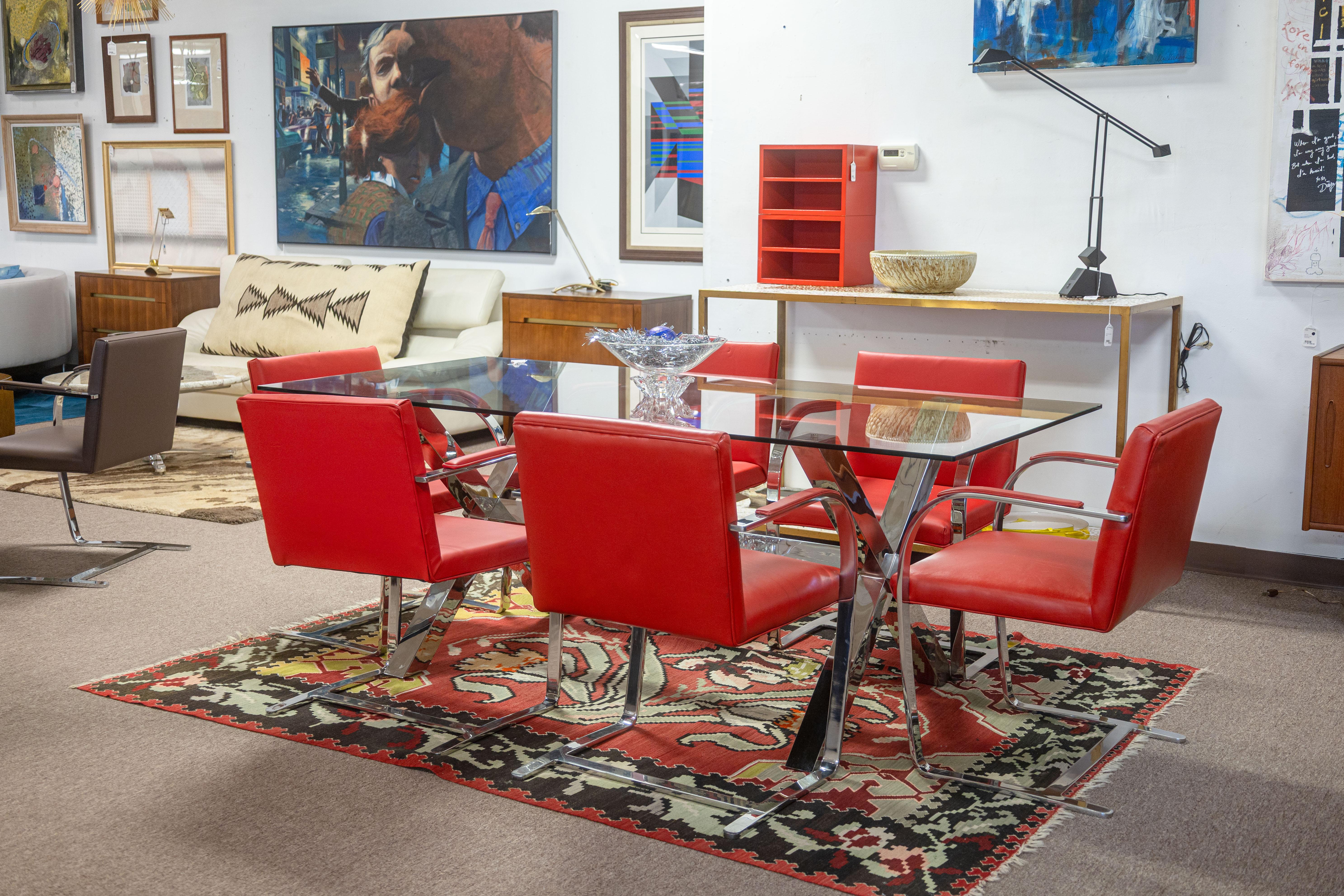 A set of 6 Brno chairs by Knoll with Ferrari leather upholstery. This is a super unique and beautiful set of collector Brno armchairs. The Brno chair is originally designed by Mies Van Der Rohe for Knoll. This particular set of chairs are the flat