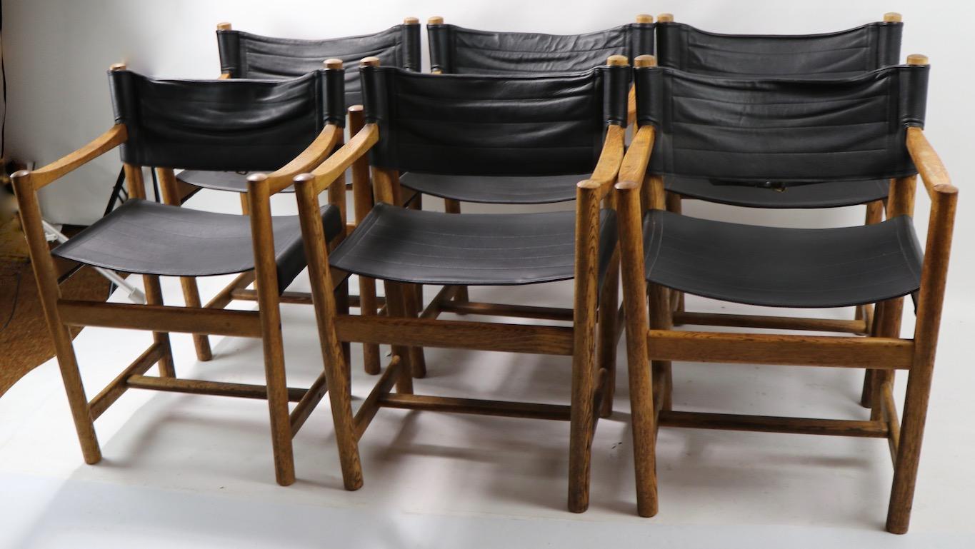 Wonderful set of dining chairs by Ditte and Adrian Heath for FDB Mobler, Denmark.
6 matching armchairs with solid oak frames, and black leather seat and backrest.
Fully and correctly marked, and numbered (8-2-77).
Total H 31 x arm H 26 x seat H