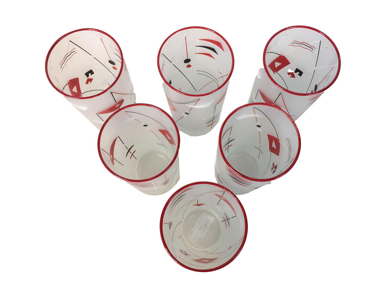 Rare, Libbey Glass Co. abstract atomic period bar glasses with black, red and white geometric shapes on a frosted ground and with a red enameled rim. All in excellent condition.