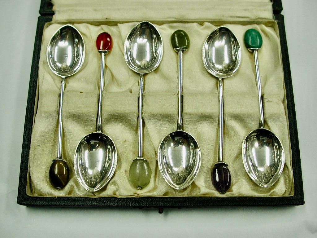 Set Of 6 Liberty & Co arts & crafts silver teaspoons with hardstone finials,1924
This pretty set is in its original 