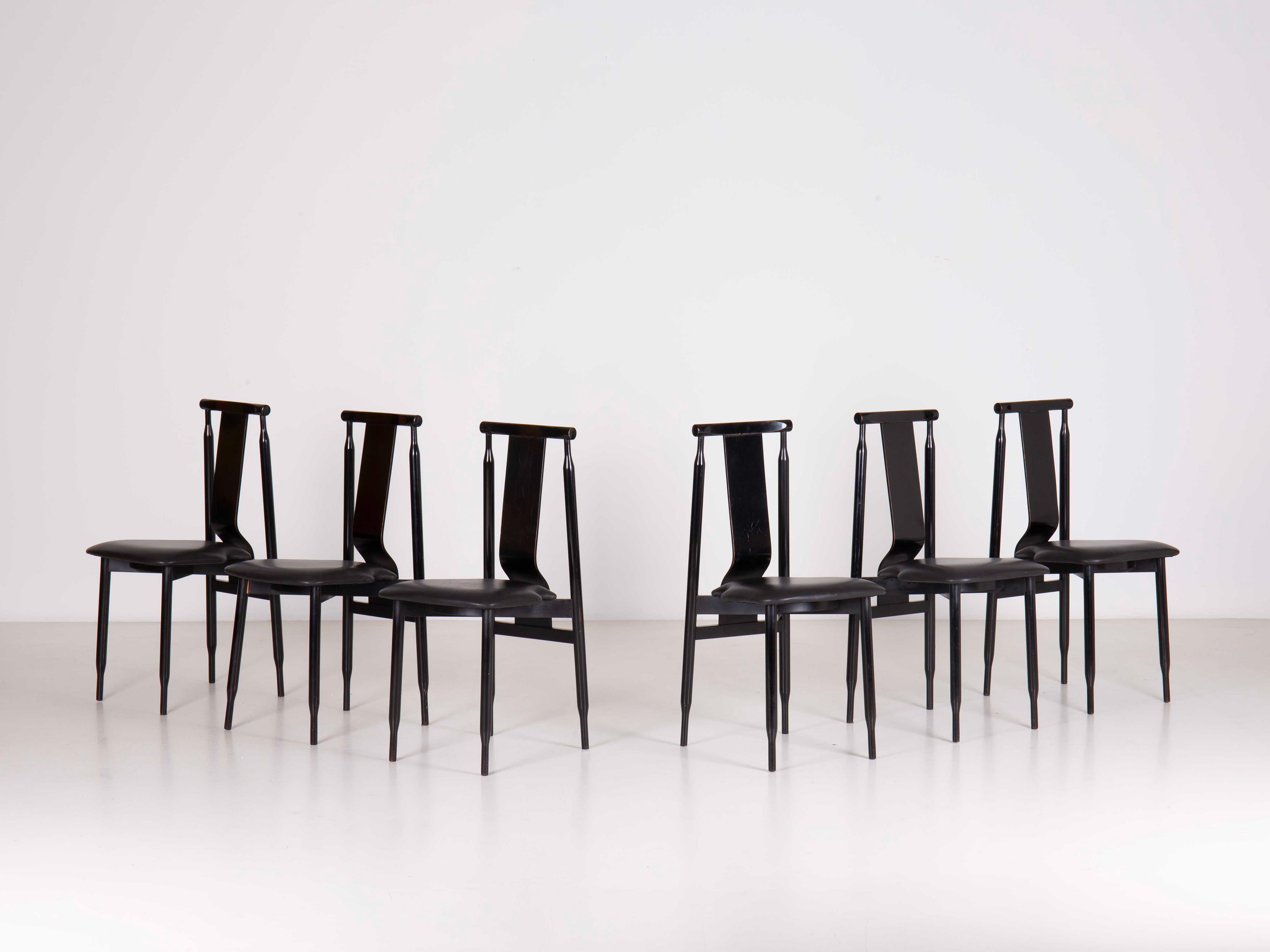 Set of 6 Lierna chairs designed by Achille & Pier Giacomo Castiglioni.

Structure in painted wood, seat slightly padded with rubber and covered in leather.

With its rather high and curved backrest it has been specially conceived as a seat to be