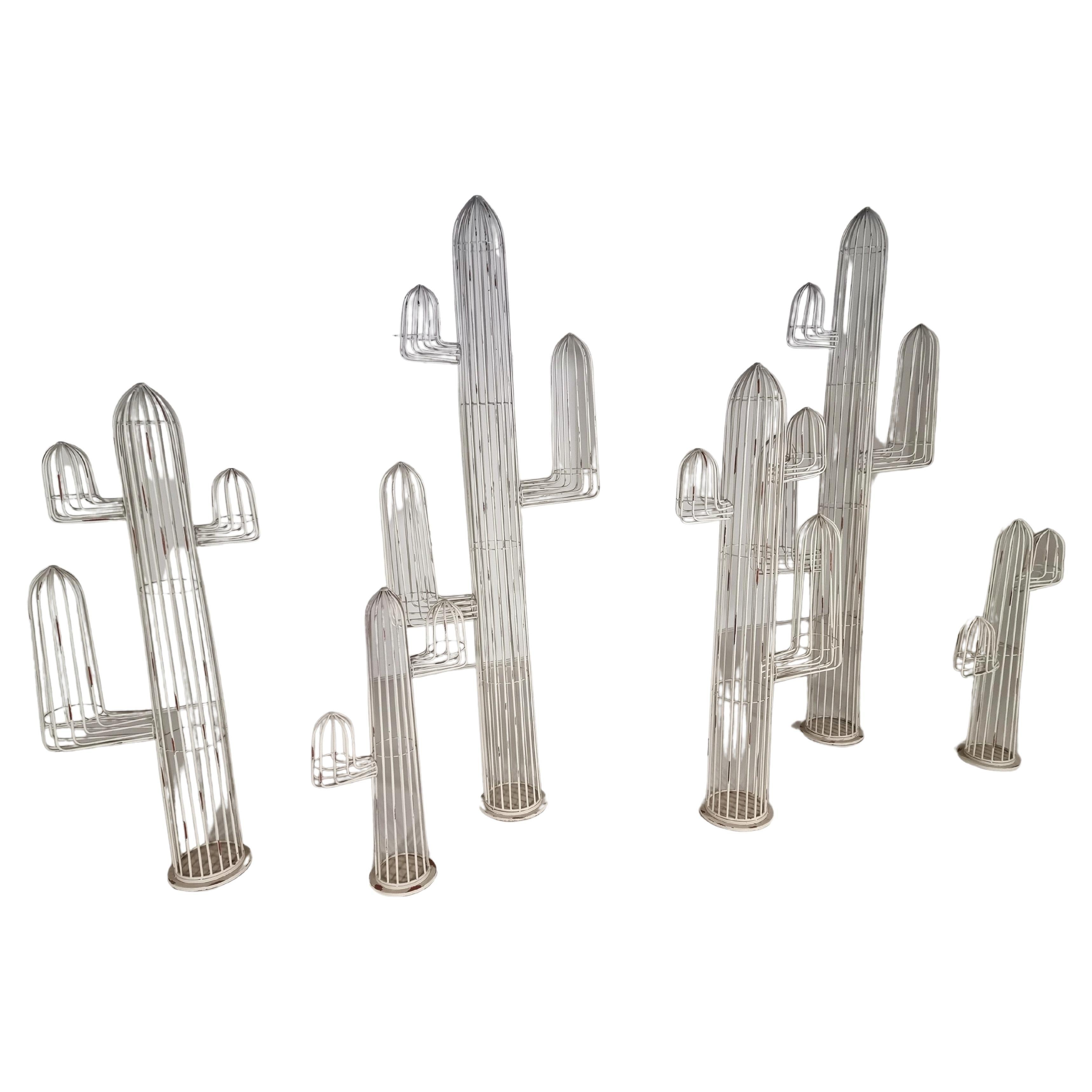 Set of 6 life-size decorative metal Cactus Sculptures. The sculptures were designed in the 1980s by a Belgium artist for a garden architectural firm.

One of a kind set that will look fantastic both indoors and outdoors

Sizes: 
240x90x30
