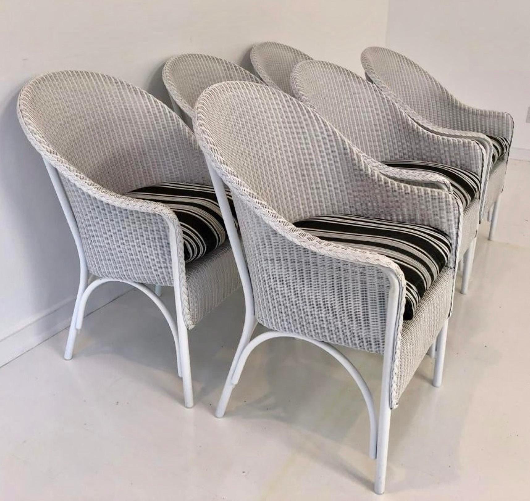Add casual elegance to your dining experience with the 6 Lloyd Loom barrel back wicker woven armchairs with cushions. Chairs are 17 inches from floor to seat.
 