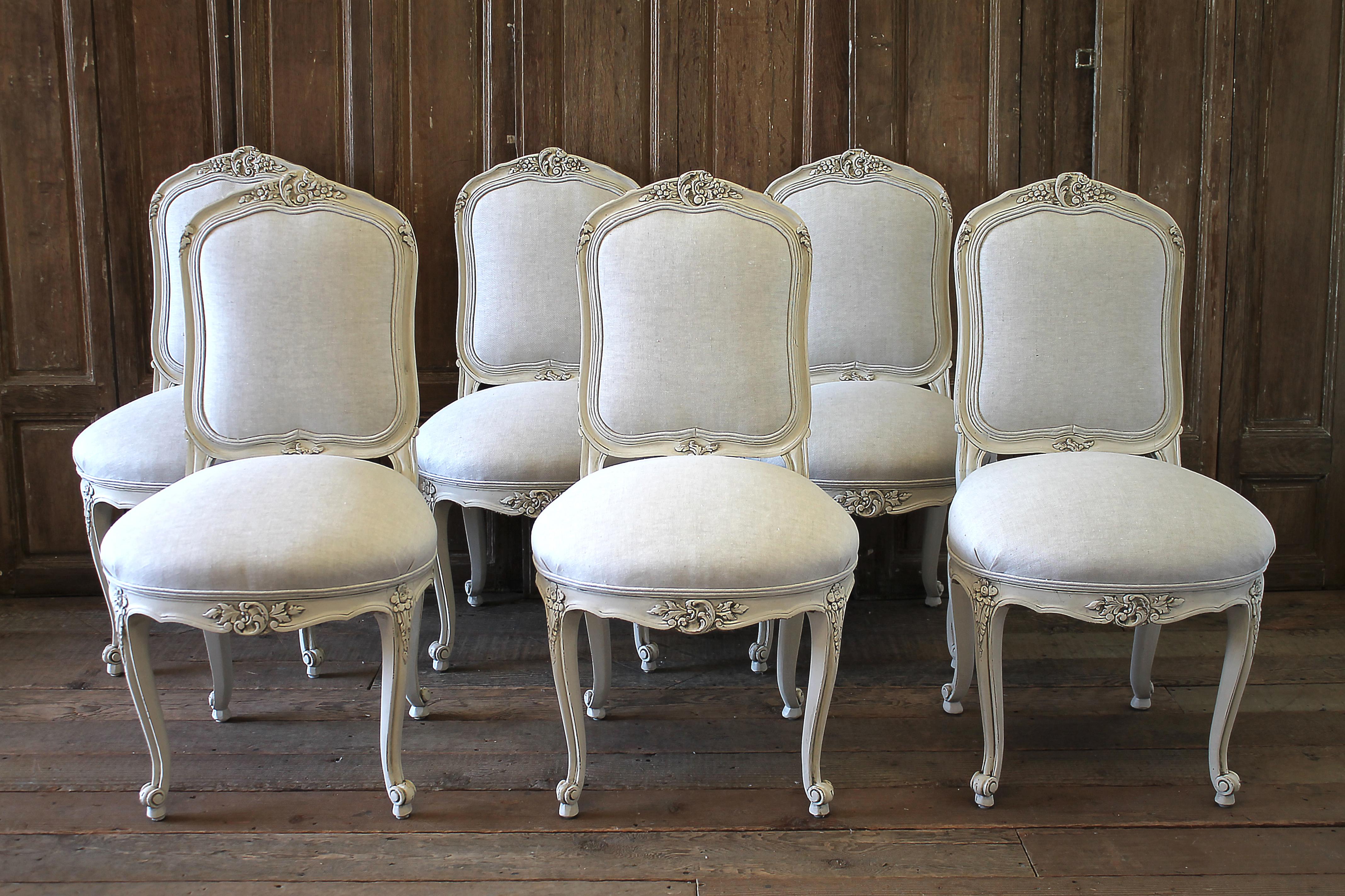 Set of 6 white painted French linen upholstered dining chairs
Very solid and sturdy, ready for everyday use. Beautiful Louis XV style carved dining chairs have been painted in a soft oyster white, with subtle distressed edges, and finished with an