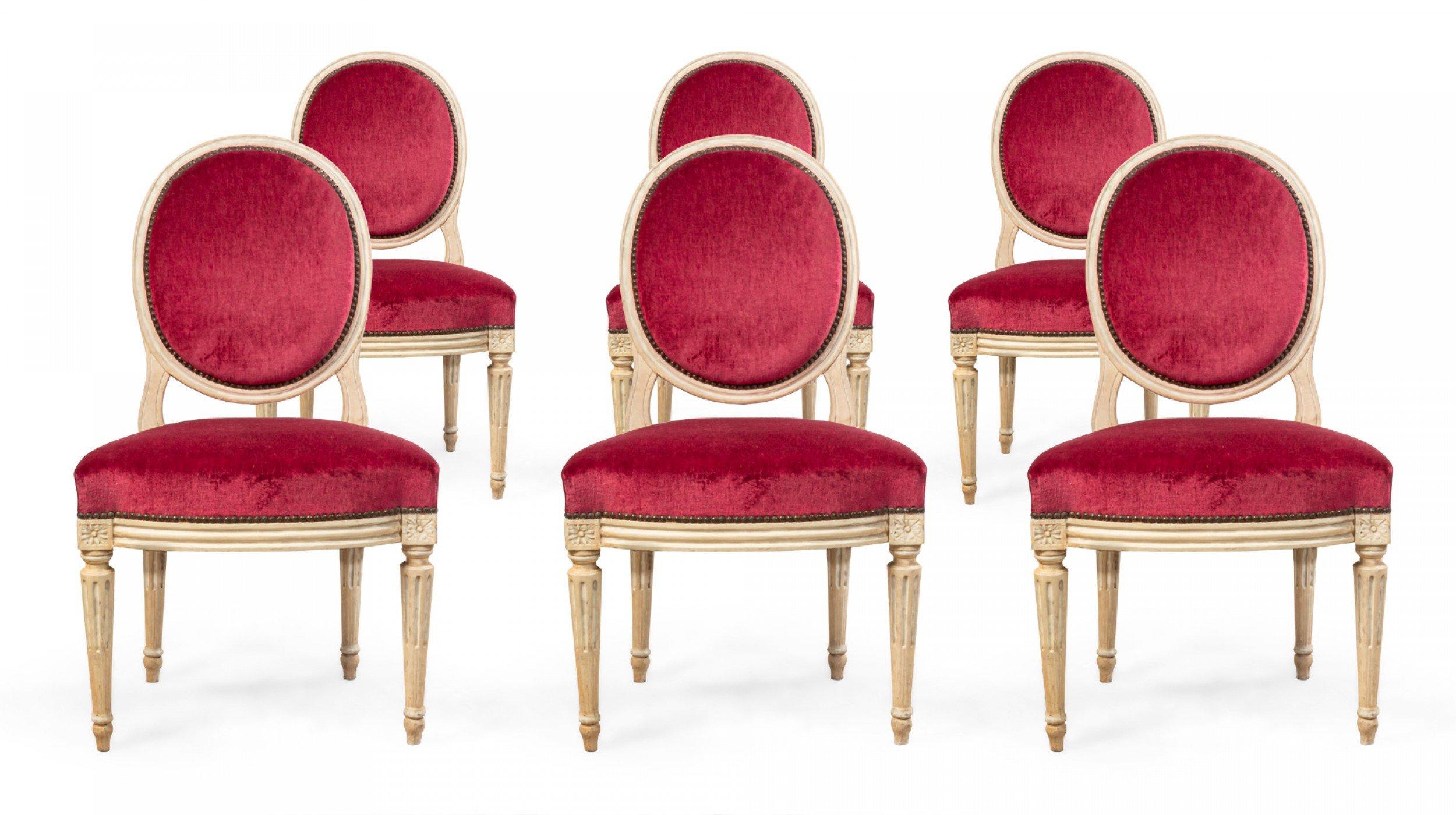 Set of 6 French Louis XVI style (20th century) oversized white painted dining side chairs with red velvet upholstery.