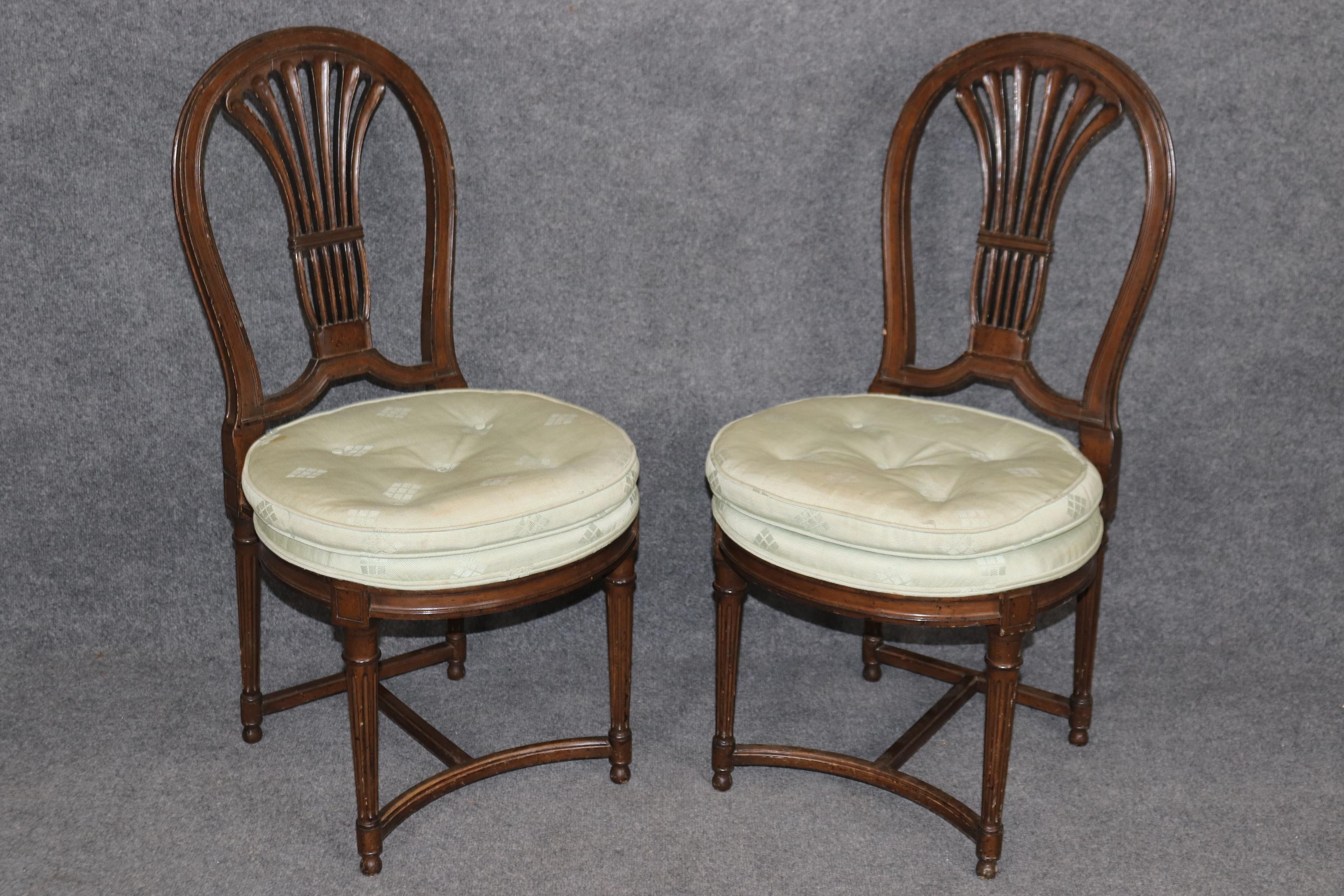 This is a fantastic set of classic French Directoire dining chairs and in good original condition. They are done in the manner and attributed to Maison Jansen. Measures 37.25 tall x 19 wide 21.5 deep seat height 19. Dates to the 1940-50s era and are