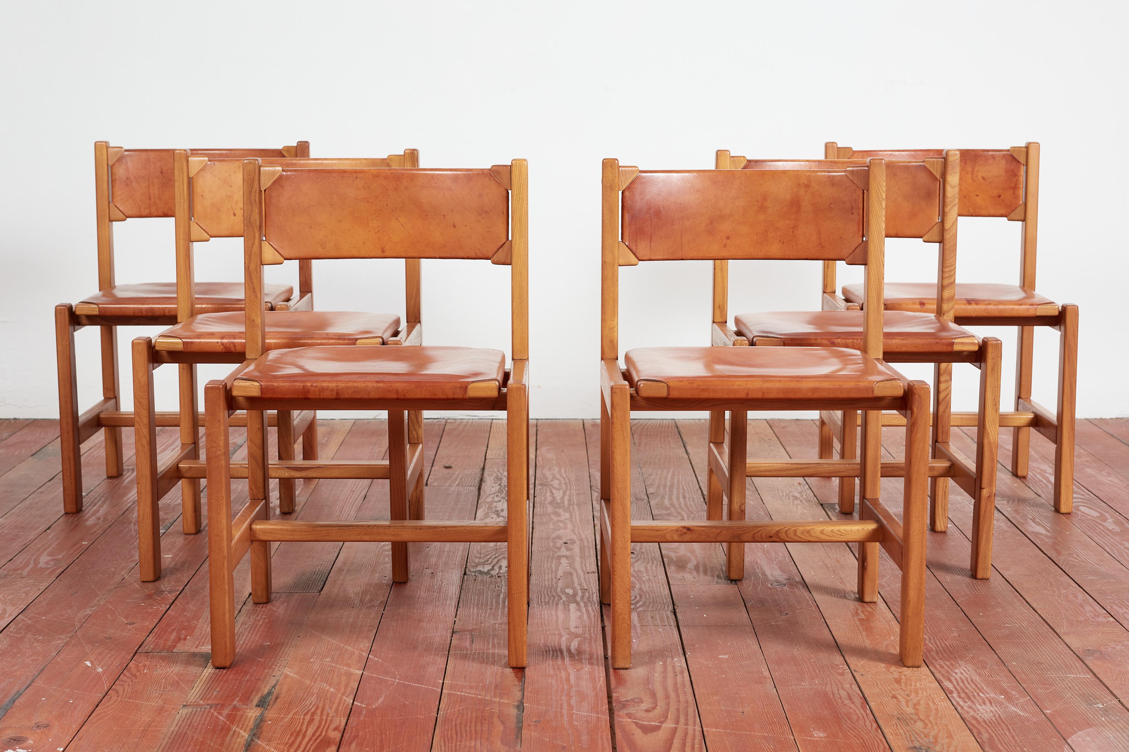 Set of 6 Maison Regain leather and elm wood chairs.

Wonderful rich patina to leather and solid construction in the style of Pierre Chapo.

France 1960's.

