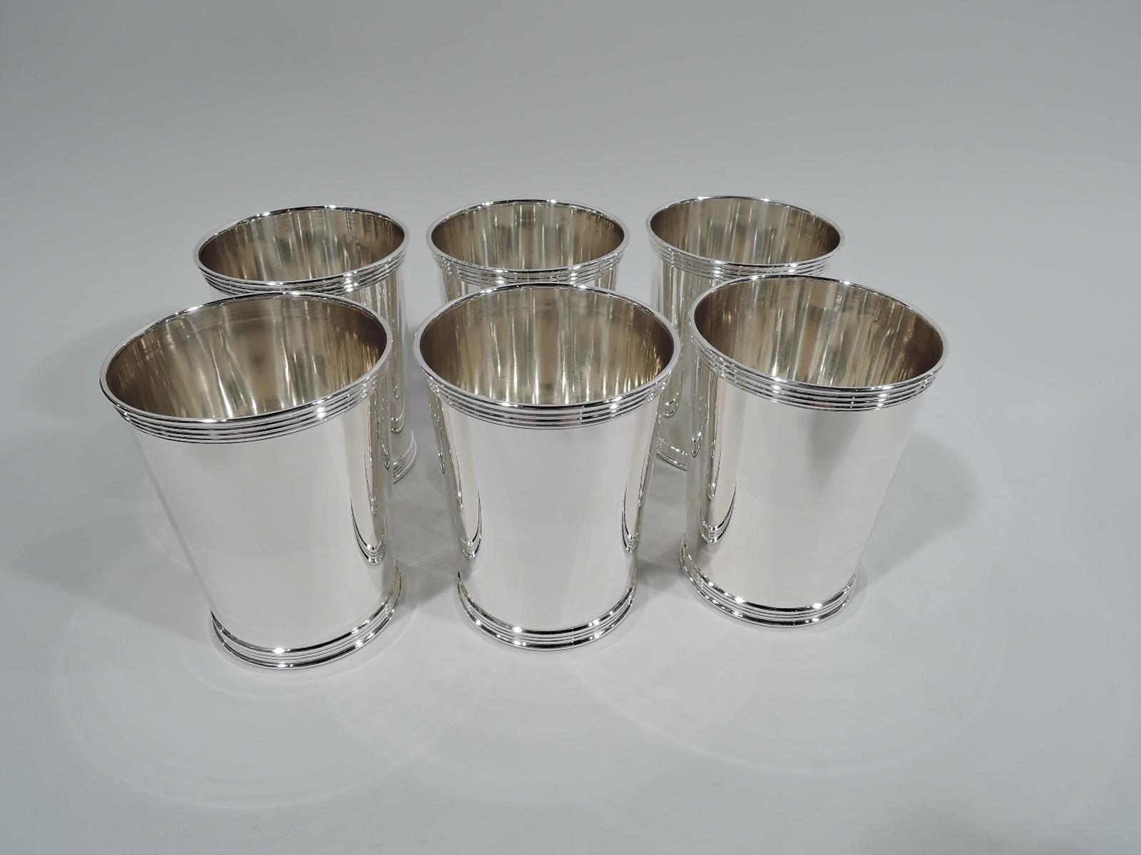 Set of 6 traditional sterling silver mint julep cups. Made by Manchester in Providence. Each: Straight and tapering sides, and reeded rim and foot. Fully marked and numbered 3759. Total weight: 23 troy ounces.