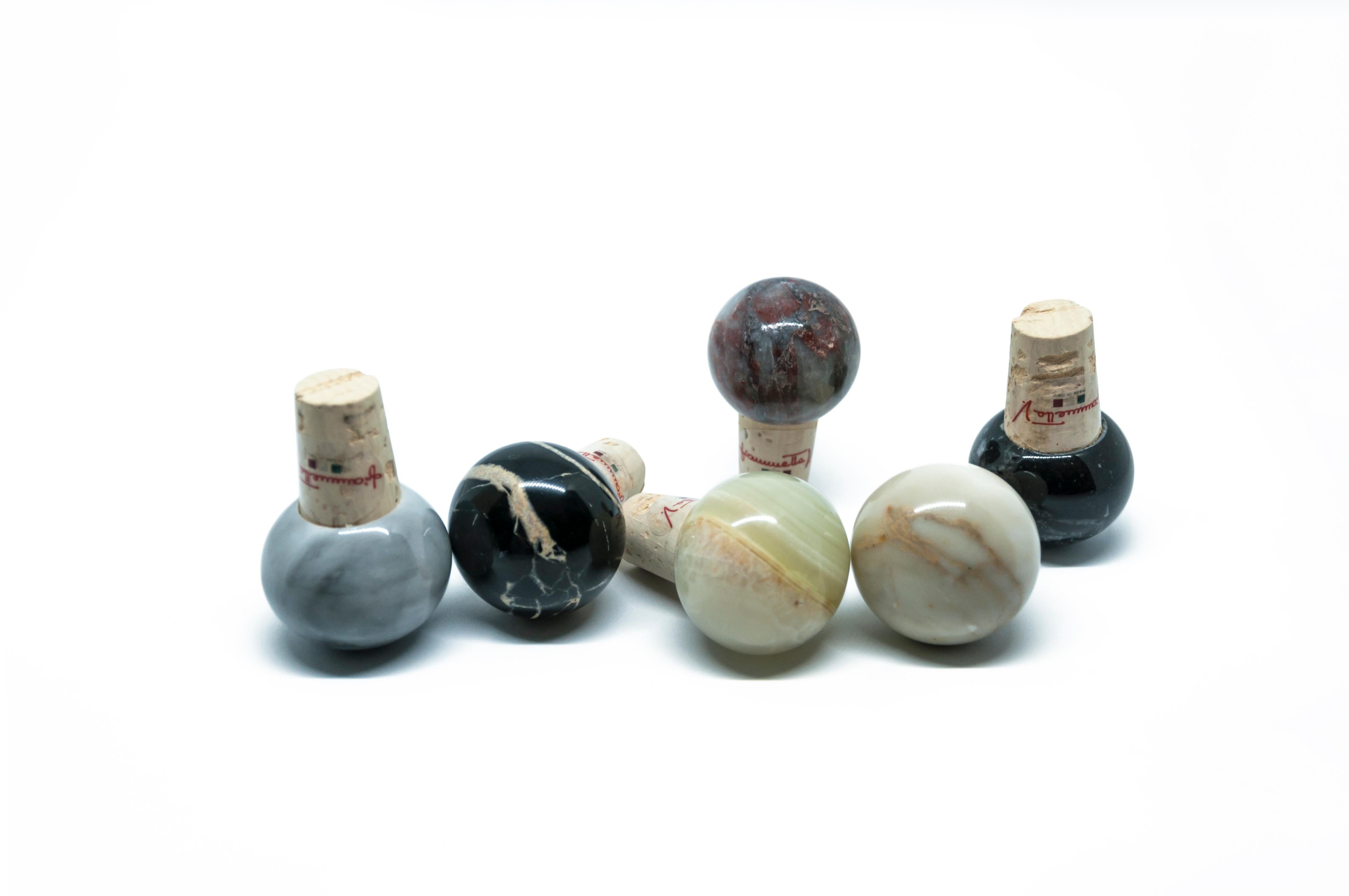 Set of 6 bottle stoppers in mixed marble colors and cork, ideal for wine and olive oil glass bottles.

Each piece is in a way unique (since each marble block is different in veins and shades) and handcrafted in Italy. Slight variations in shape,