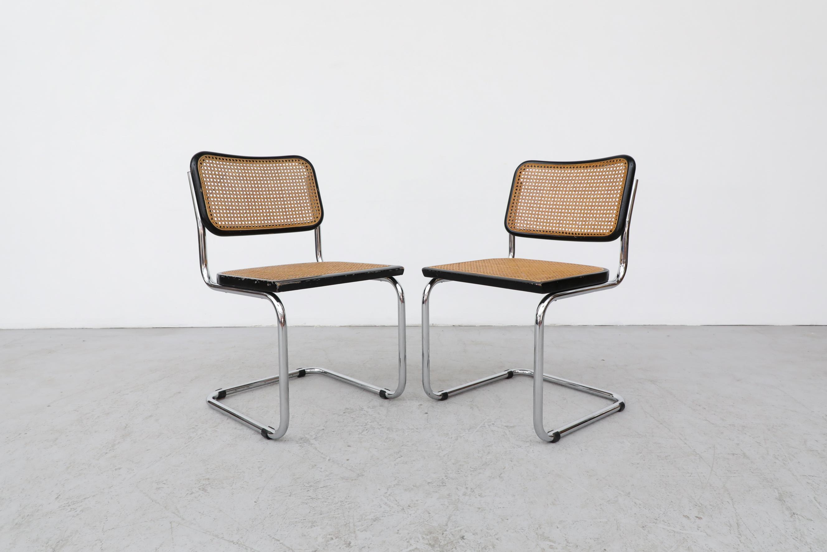 Iconic set of Marcel Breuer B32 Cesca chairs featuring a cantilevered chrome-plated steel frame, an ebonized lacquered beech finish, and cane seat. All are in original condition with visible wear and patina. Some have heavy chrome loss to the frame.